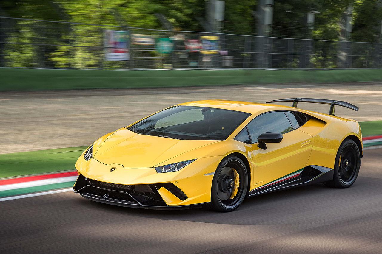 Yellow Lamborghini Performante racing down track