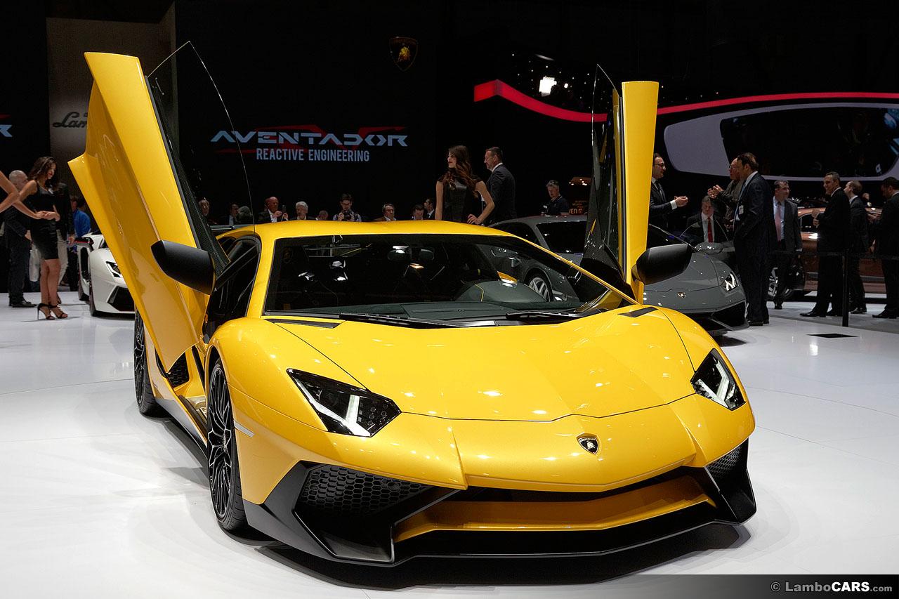 Yellow Lamborghini Aventador with doors raised in showroom