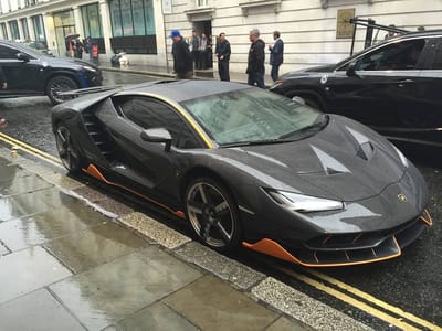 All Exciting Fastest Lamborghini Models That Can Cross 200 Mph: Some Will Surprise You! 21 Black lamborghini centenario lp770-4 with gold trim parked at side of road