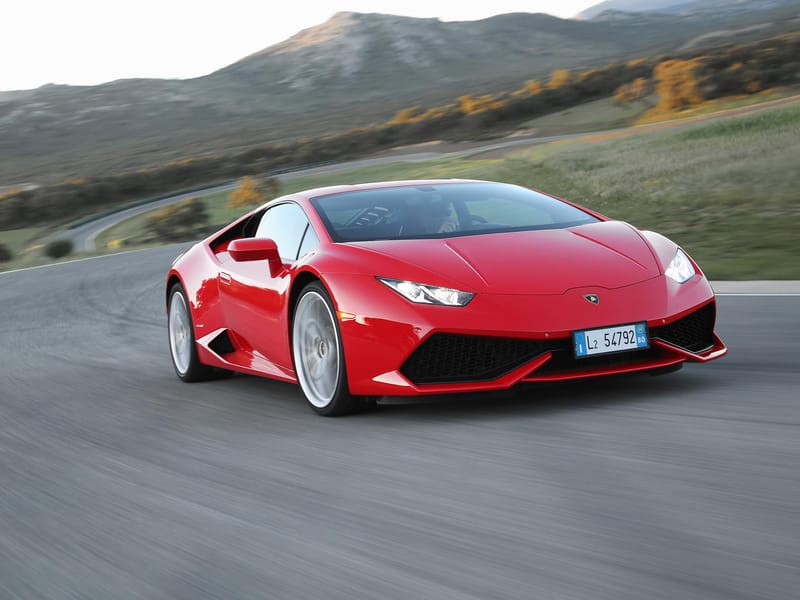 Red Lamborghini Huracan LP610-4 speeding around corner