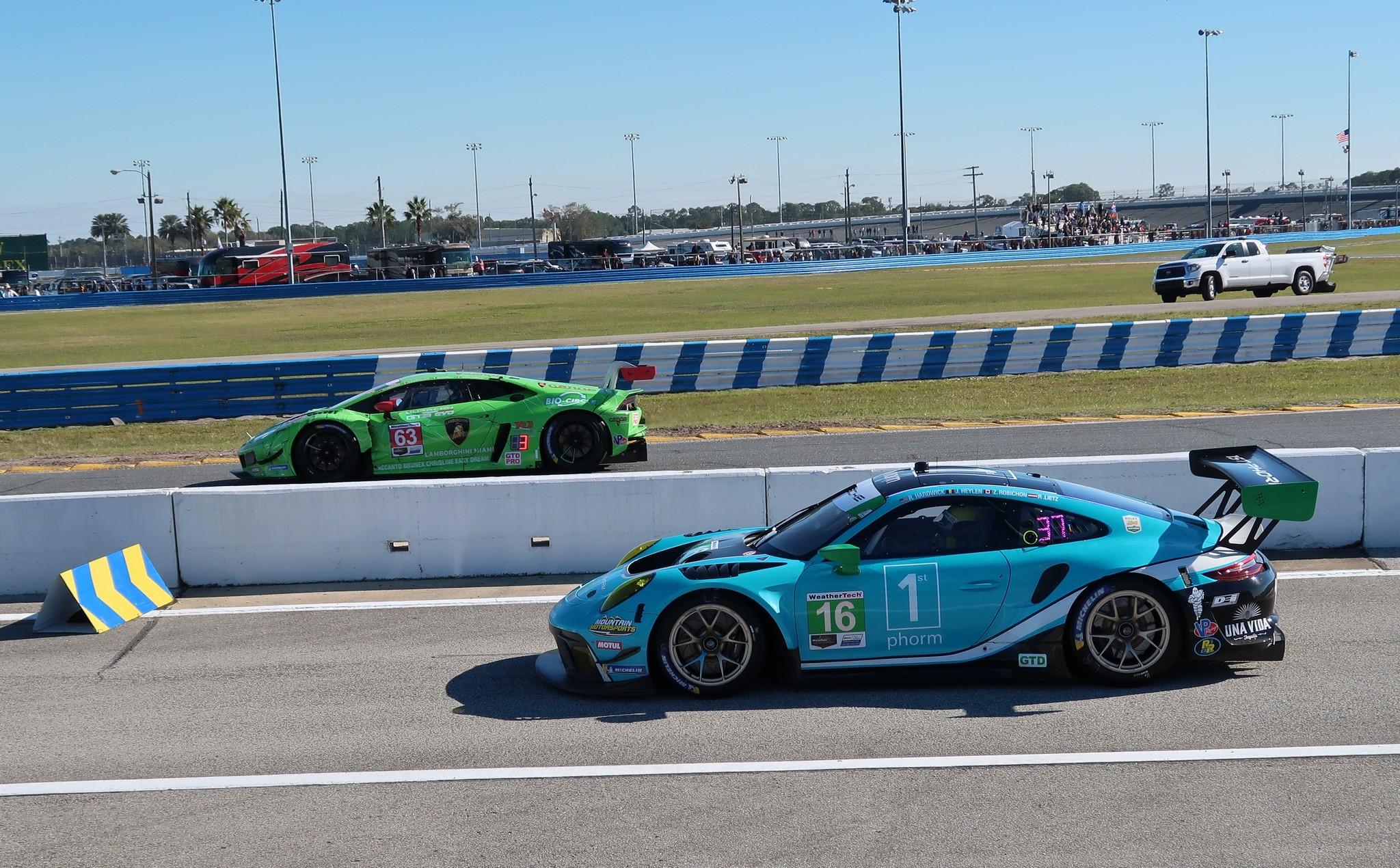 Lamborghini and Porsche on racetrack