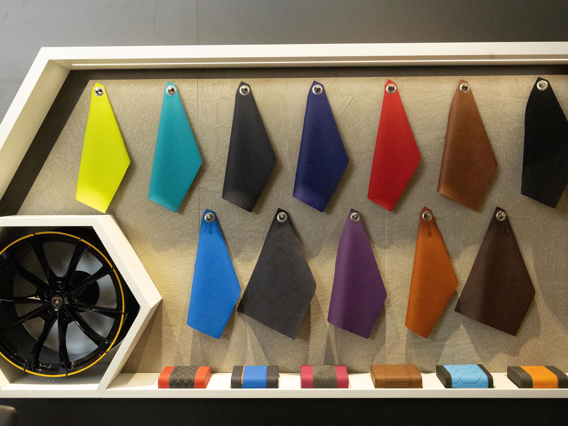 Lamborghini Finally Arrives In Egypt: Carbon-Neutral Supercars Meet Cairo'S Elite 7 Lamborghini material customization wall with leather swatches and performance wheel