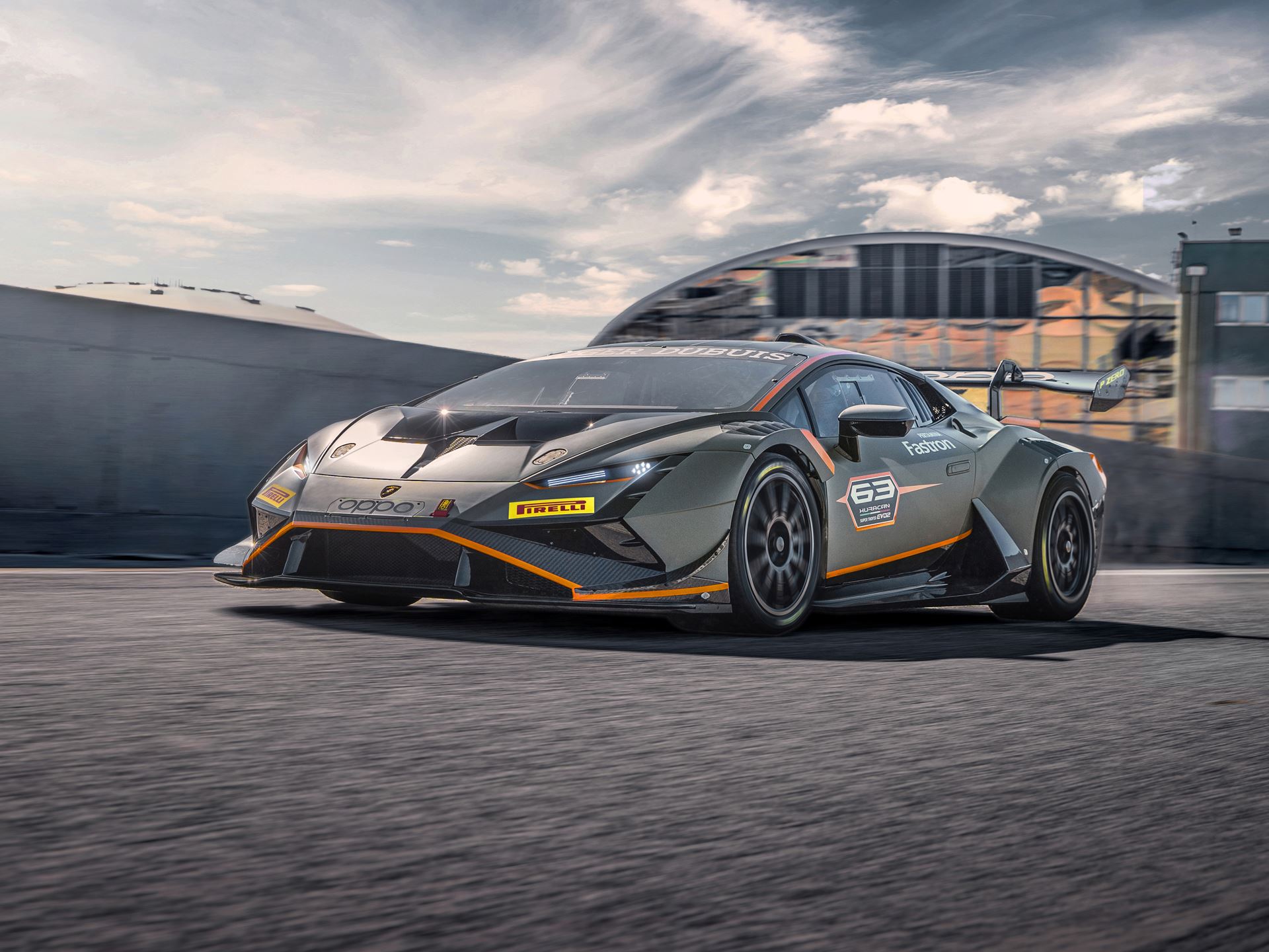 Lamborghini'S New Racing Boss Comes Straight From Ferrari'S Playbook, And The Timing Is No Coincidence 3 Lamborghini huracán super trofeo evo2 race car at speed on track with orange accents and pirelli branding