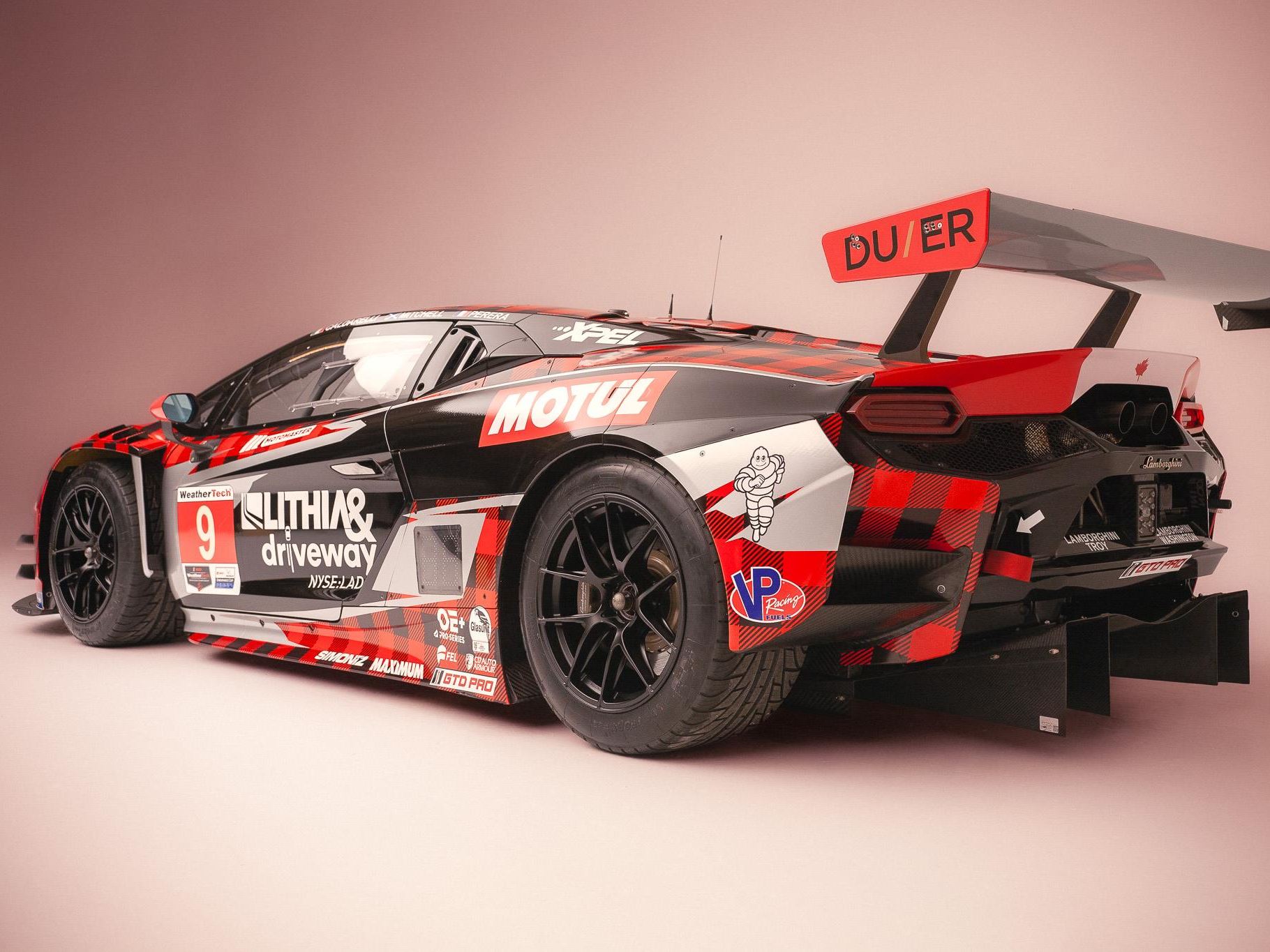 Lamborghini'S First In-House Gt3 Car Faces Brutal Sebring Debut 3 Lamborghini huracan gt3 evo race car number 9 rear view in studio showing large aerodynamic wing and diffuser with black and red plaid livery