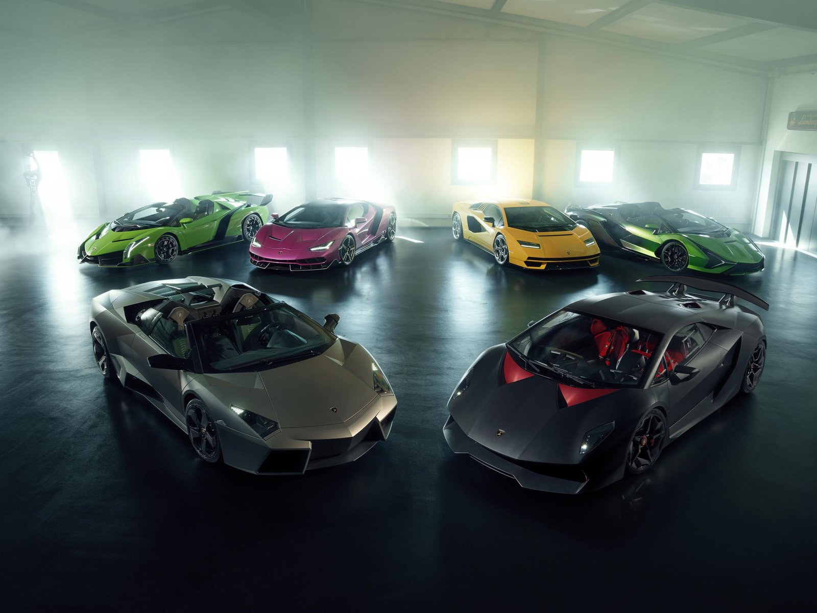 Multiple hypercars exterior wide shot 001