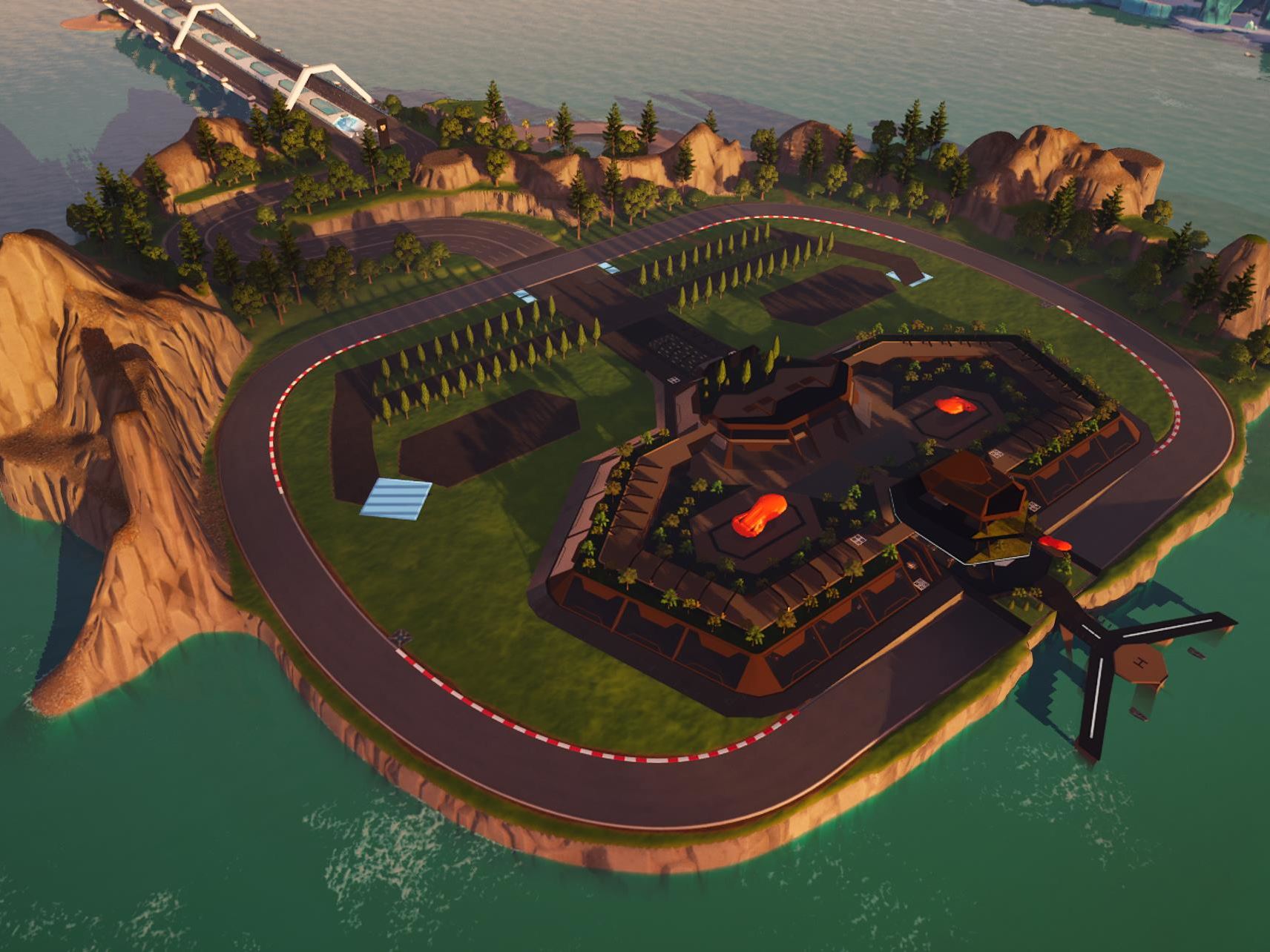 Aerial view of dedicated racing island with winding track and central building complex