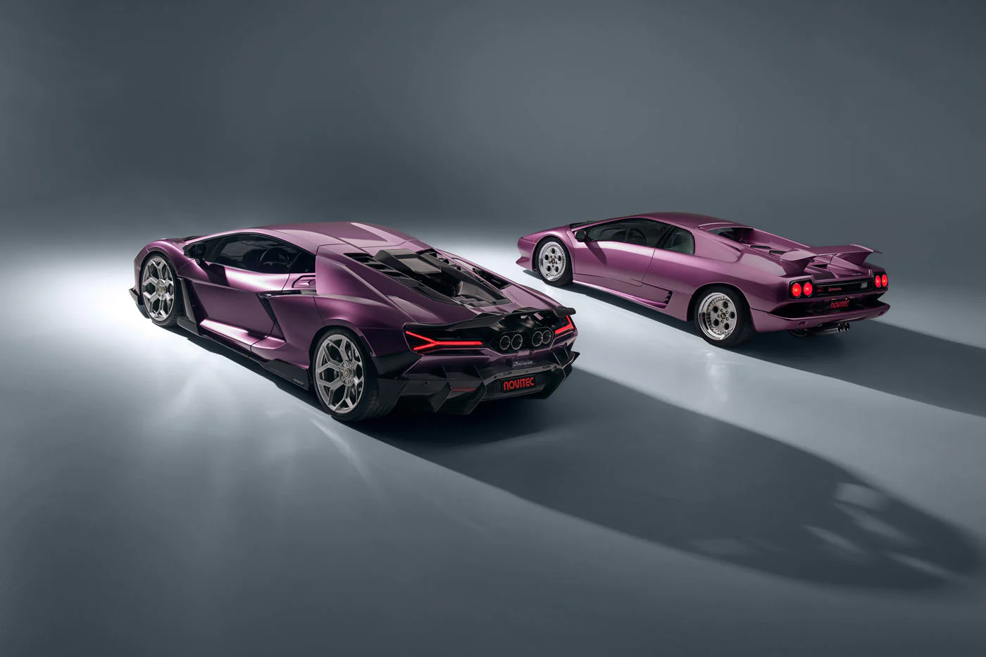 Novitec'S 1,048 Hp Revuelto Program: What It Offers That Lamborghini'S Own Ad Personam Cannot 45 A purple novitec lamborghini revuelto and a classic purple lamborghini diablo are positioned in a grey studio, viewed from a 3/4 rear angle. The image contrasts the aggressive, modern rear styling of