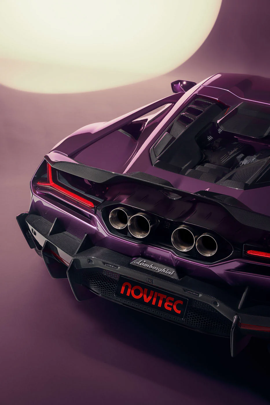 Novitec'S 1,048 Hp Revuelto Program: What It Offers That Lamborghini'S Own Ad Personam Cannot 3 Rear view of a purple novitec lamborghini revuelto showing quad exhaust tips, carbon fiber diffuser, y-shaped taillights, and novitec branding