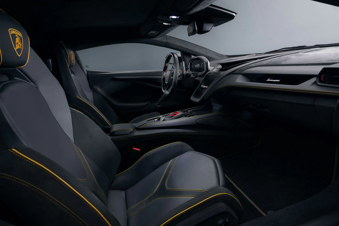 Novitec'S 1,048 Hp Revuelto Program: What It Offers That Lamborghini'S Own Ad Personam Cannot 7 Interior of the lamborghini revuelto showing black leather and alcantara seats with yellow stitching, digital instrument cluster, and carbon fiber accents