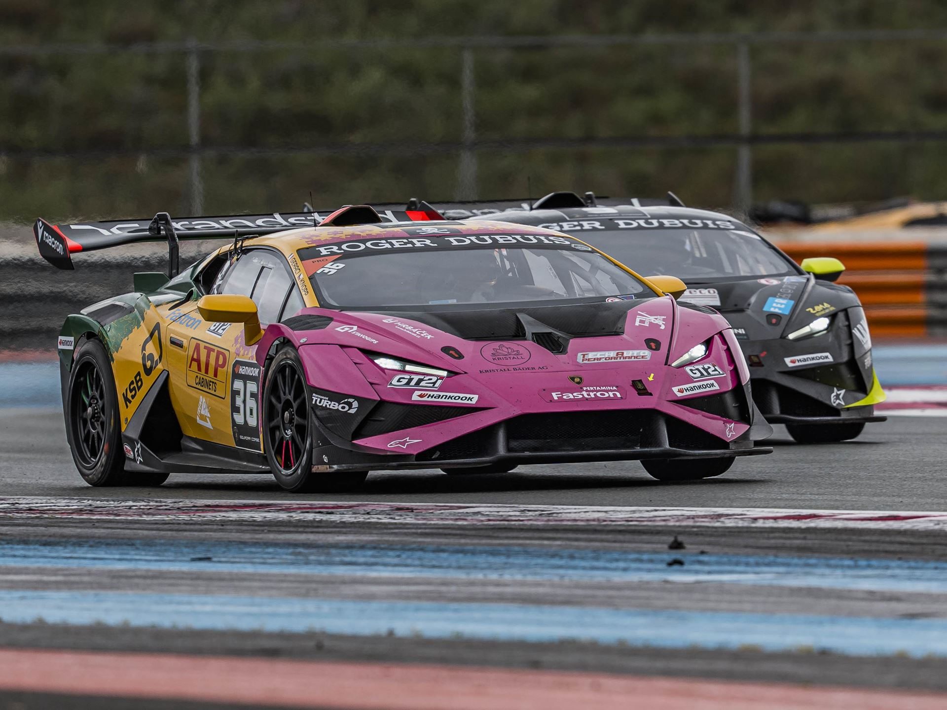 30 Huracán Super Trofeo Evo2S Hit Paul Ricard This Weekend As Lamborghini'S V10 One-Make Series Enters Year 18 7 A pink and yellow lamborghini huracán race car number 36 closely followed by a black huracán at circuit paul ricard