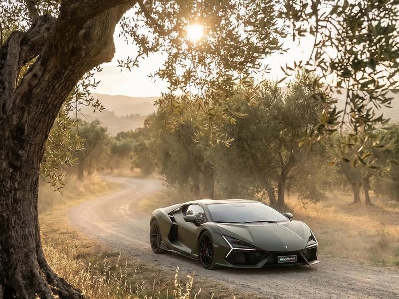 Dark green Lamborghini Revuelto driving through an Italian olive grove at sunset