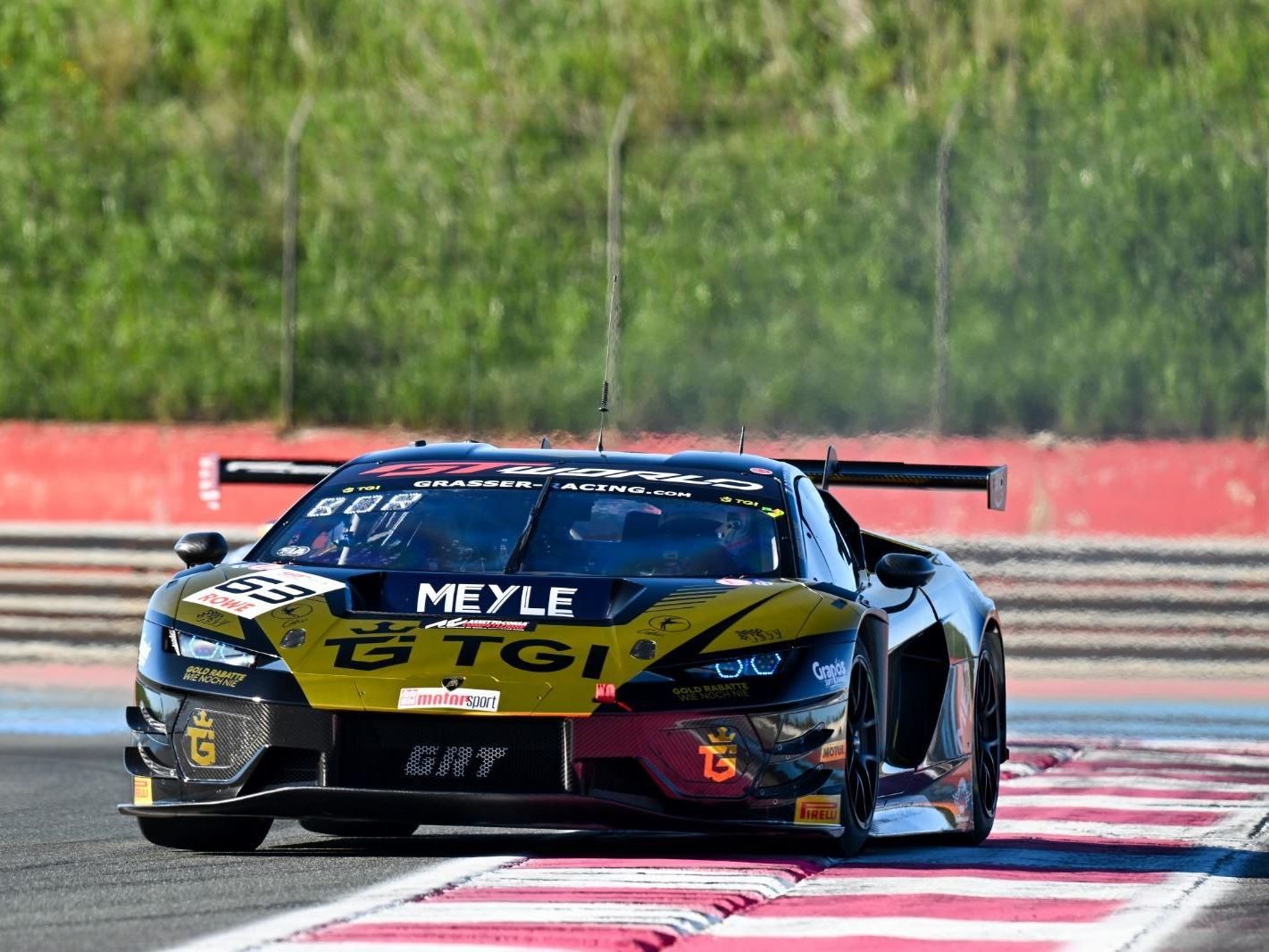 Temerario Gt3 Heads To Paul Ricard For European Debut, But Lamborghini Won'T Show You What It Looks Like 7 Black and gold lamborghini huracán gt3 evo race car number 63 mid-corner on a race track with sponsor decals visible