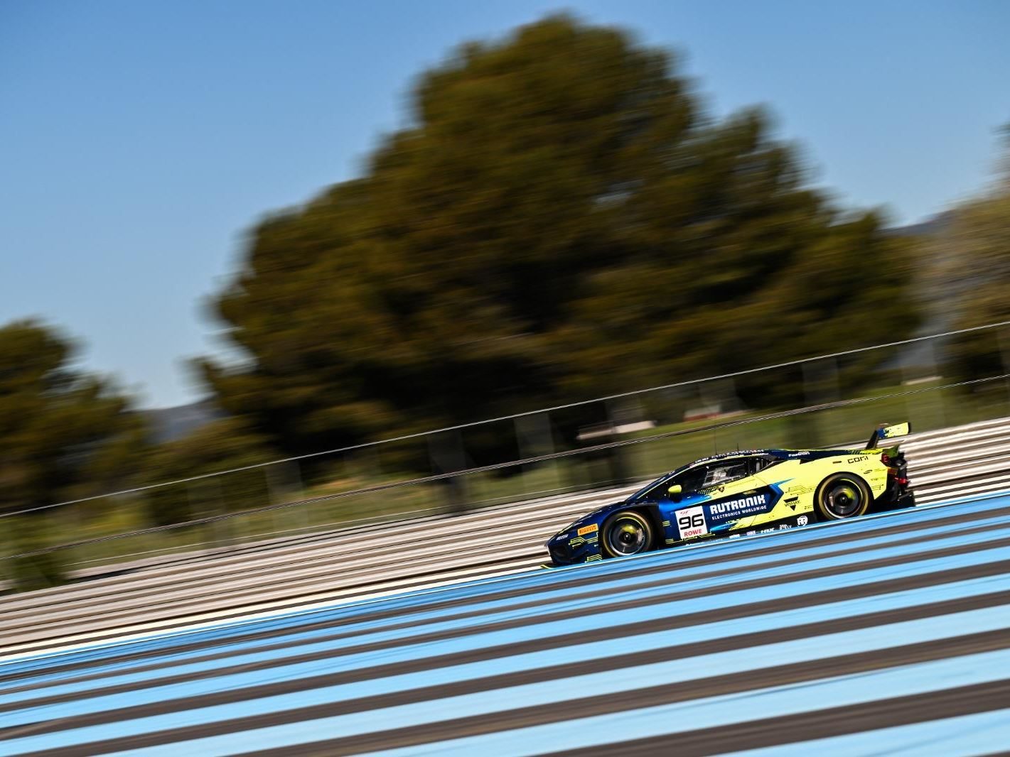 Temerario Gt3 Heads To Paul Ricard For European Debut, But Lamborghini Won'T Show You What It Looks Like 9 Blue and yellow lamborghini huracán gt3 evo race car number 96 at speed on a race track with blurred background