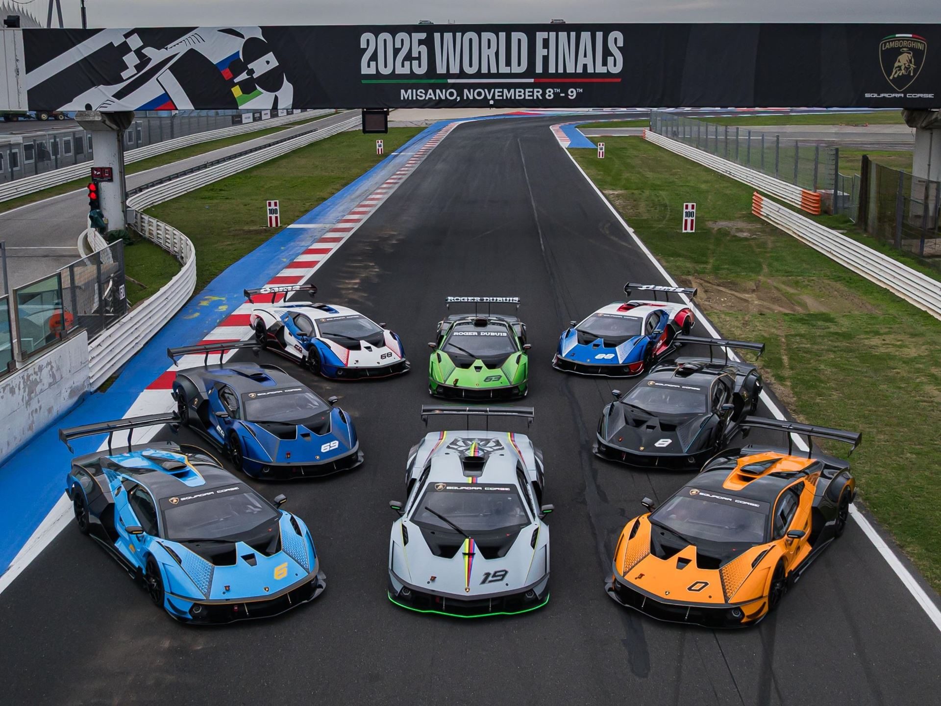 Eleven Winners, Seven Champions: The Huracán Super Trofeo Evo2'S Triumphant Farewell At Misano 3 Collection of lamborghini huracán super trofeo evo2 race cars in various liveries parked on the misano circuit under the 2025 world finals banner