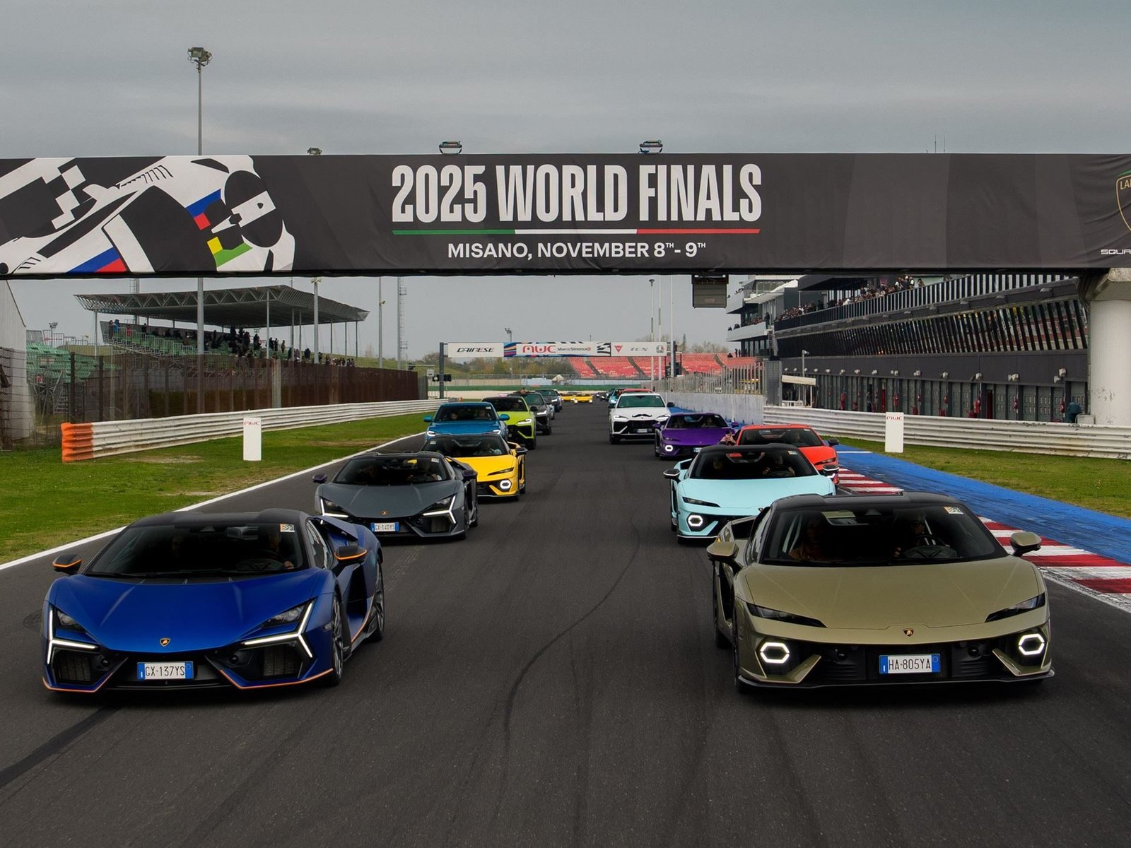 Lineup of Lamborghini Revuelto, Huracán, and Urus models on the Misano circuit under the 2025 World Finals banner