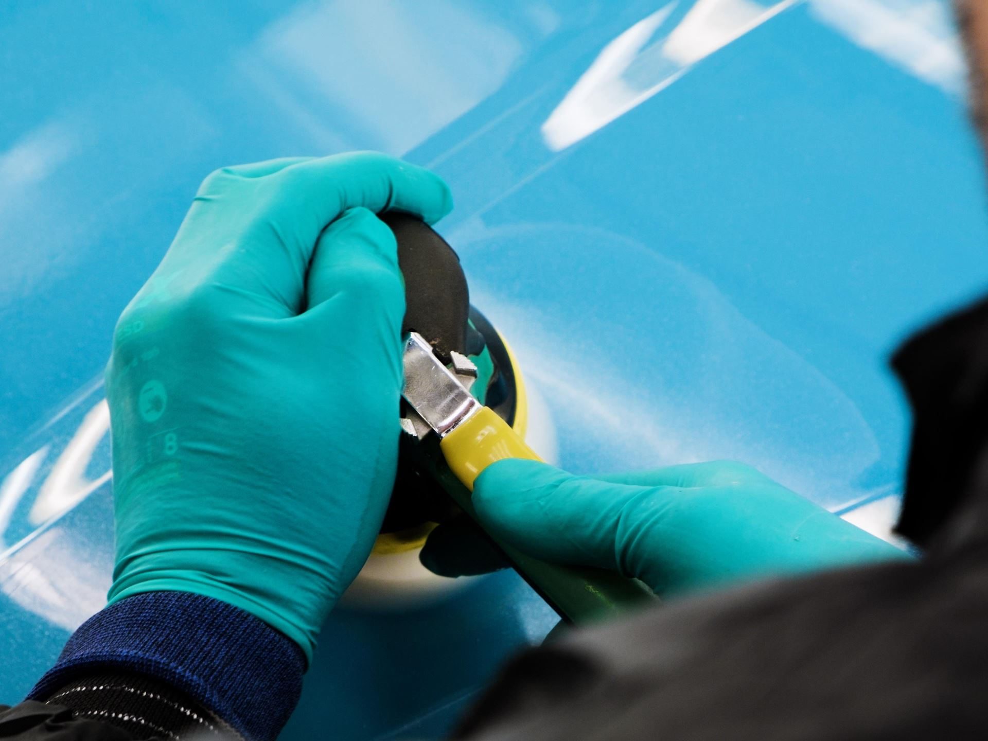 Lamborghini'S Ad Personam Turns 20 With A Miura-Inspired Paint That 96% Of Buyers Should Care About 3 Gloved technician meticulously working on the surface of a light blue lamborghini body panel