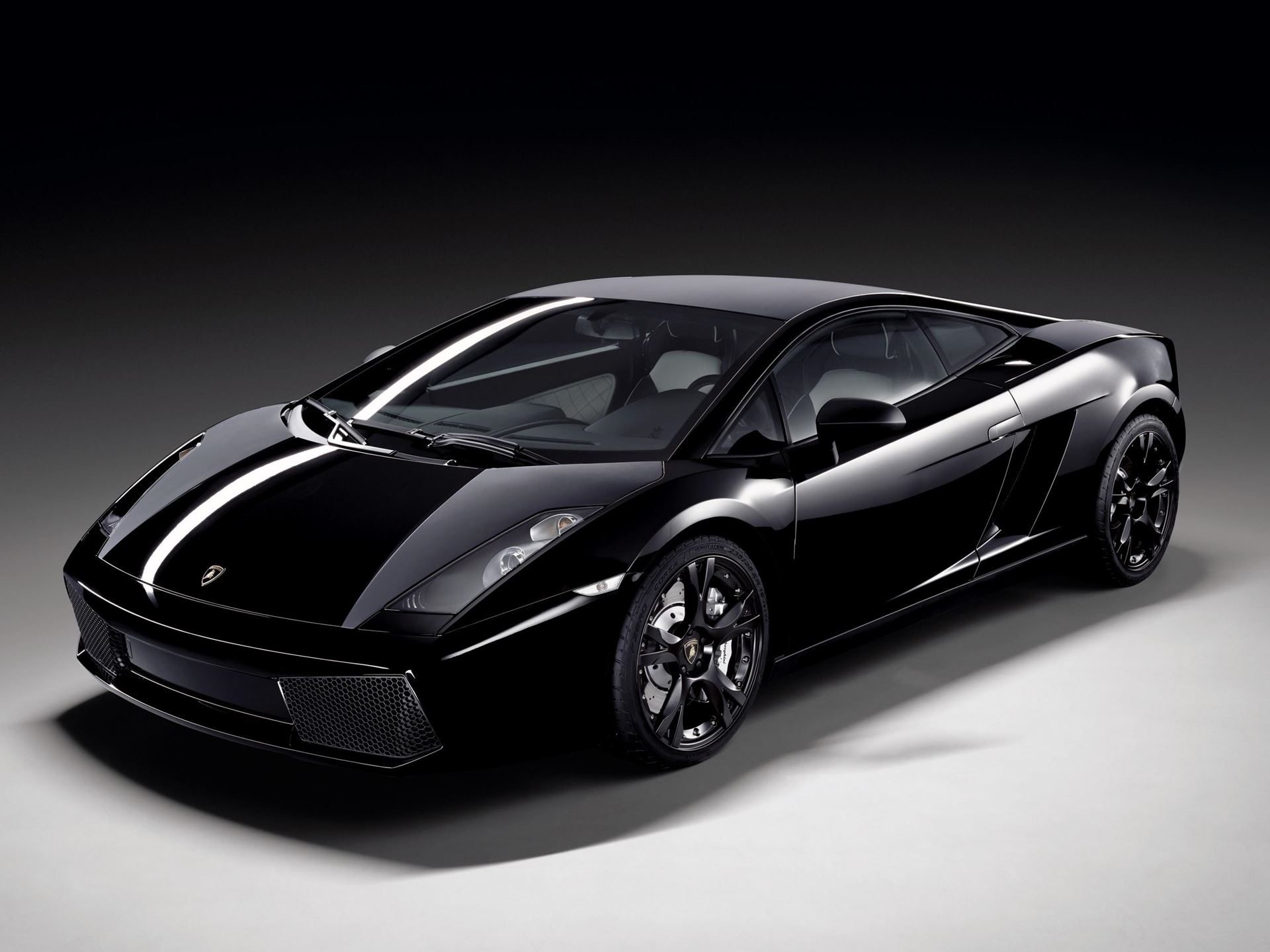 Lamborghini'S Ad Personam Turns 20 With A Miura-Inspired Paint That 96% Of Buyers Should Care About 5 Black lamborghini gallardo with white racing stripe in studio lighting, representing the first ad personam launch car