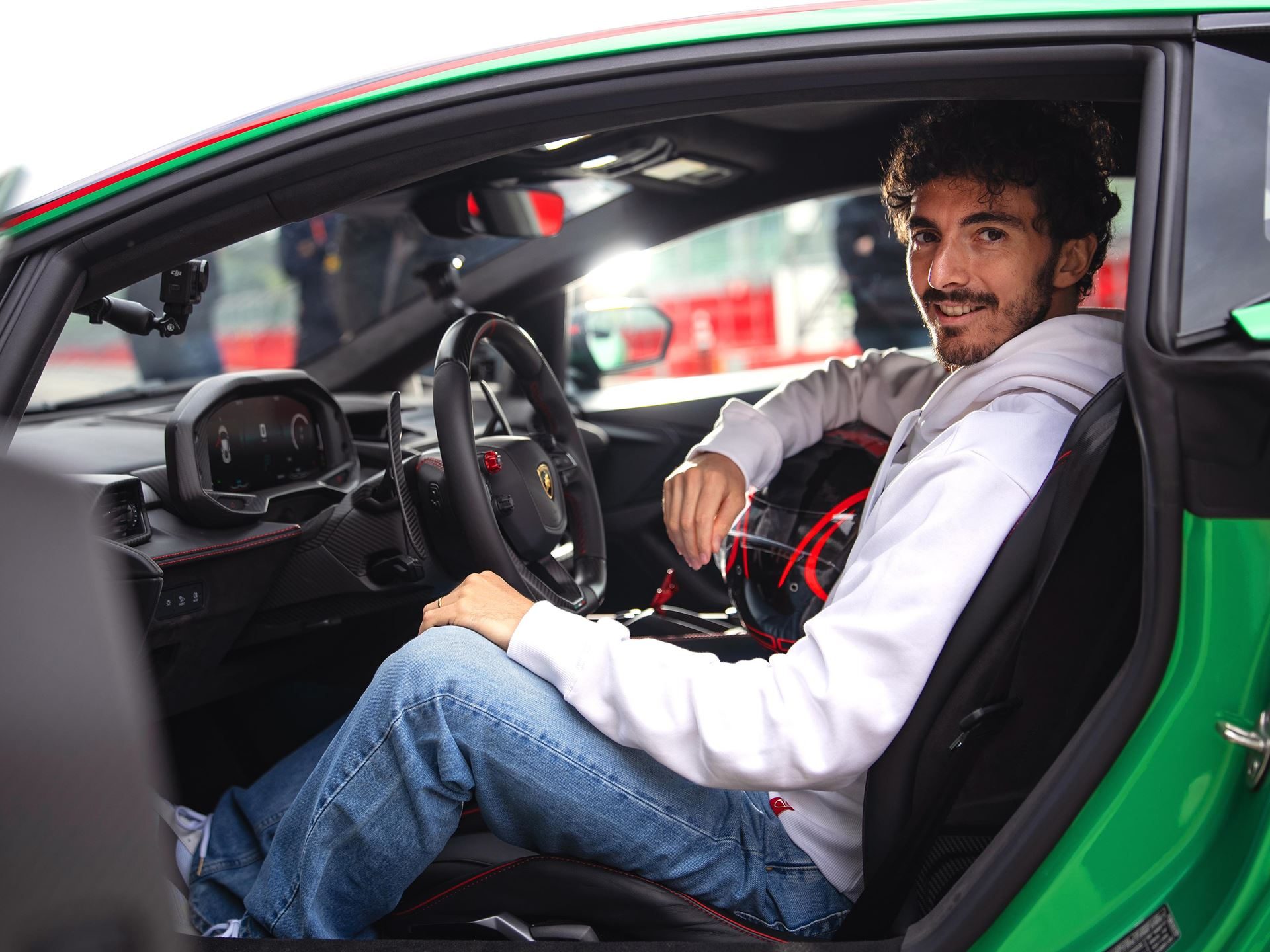 Motogp Champion Pecco Bagnaia Reports The Temerario'S Twin-Turbo V8 Feels Naturally Aspirated At 10,000 Rpm 7 Francesco bagnaia seated in the lamborghini temerario cockpit, showing the digital instrument cluster, multi-function steering wheel, carbon fiber trim, and red stitching