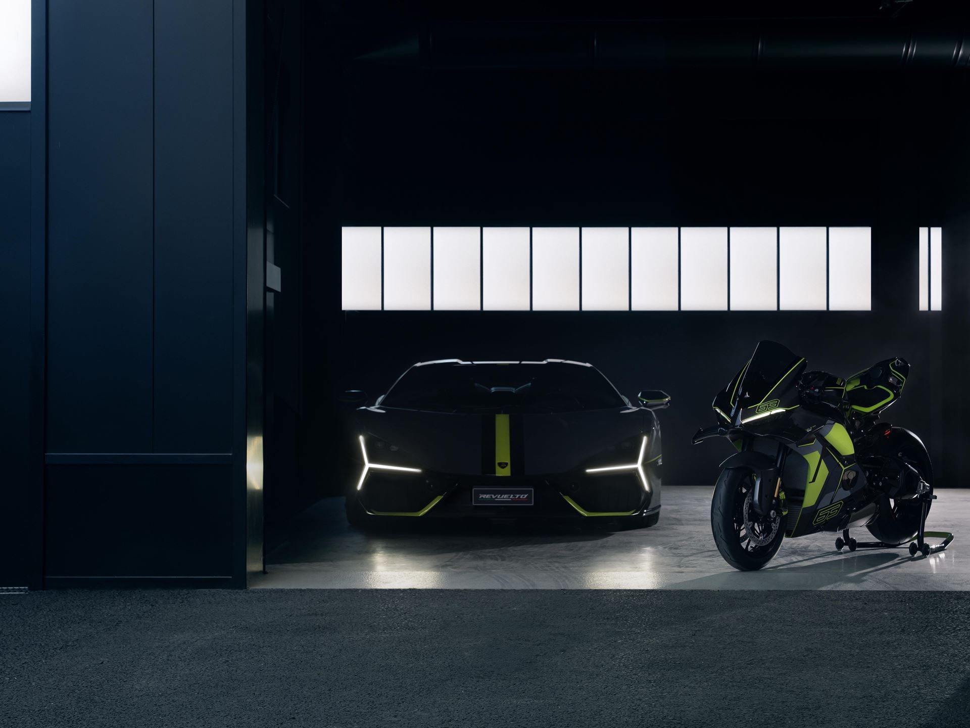 Ducati'S Panigale V4 Lamborghini Lets 63 Revuelto Owners Build A Matching Two-Wheel Garage 9 Lamborghini revuelto and ducati panigale v4 lamborghini parked side by side in a dark studio, illuminated by their lights and matching neon green accents