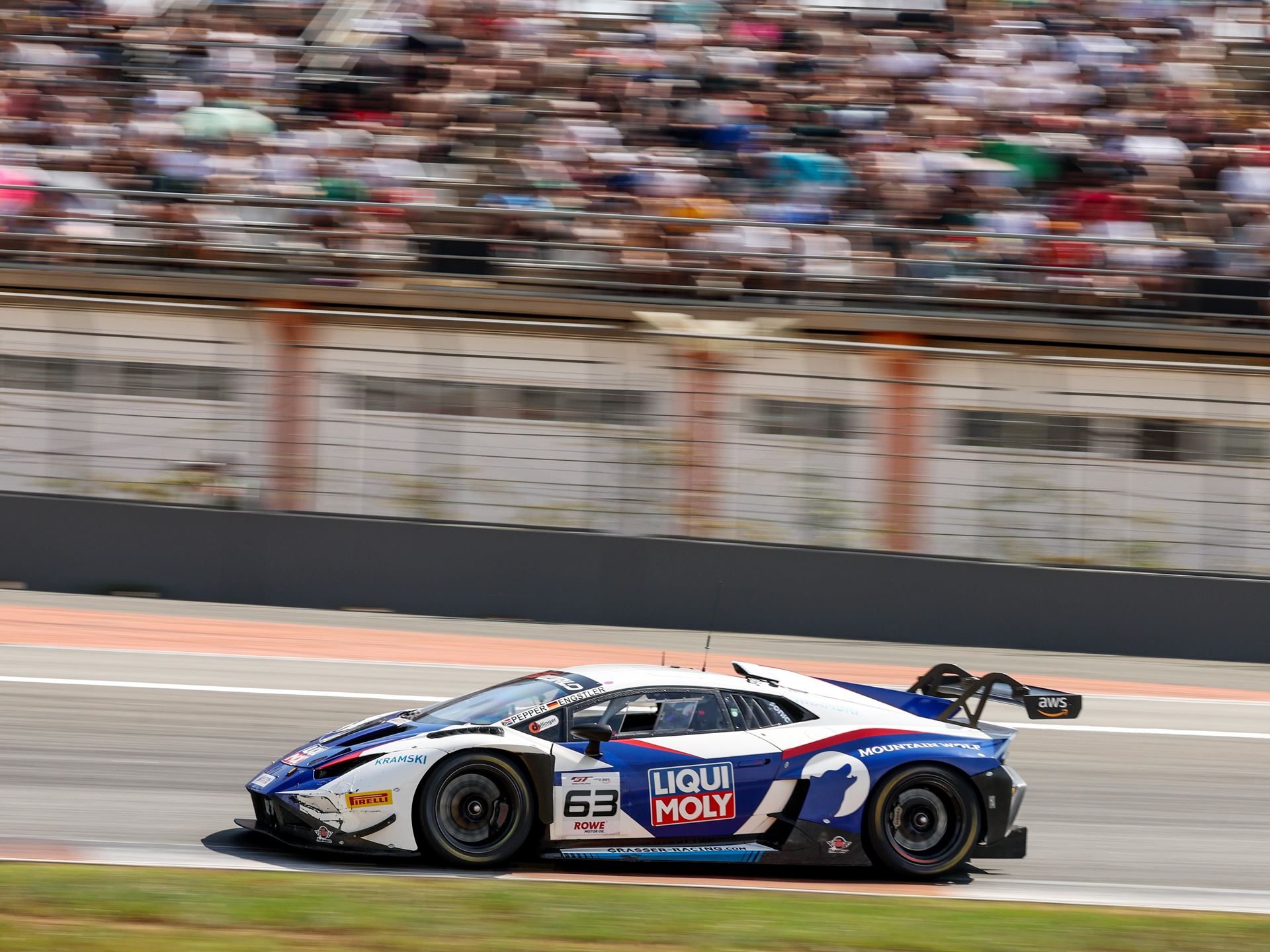 Huracán Gt3 Scores 197Th Win At Valencia As Lamborghini Prepares To Hand A Dynasty To The Temerario 3 Lamborghini huracán gt3 evo2 at speed on a race track straight with blurred background