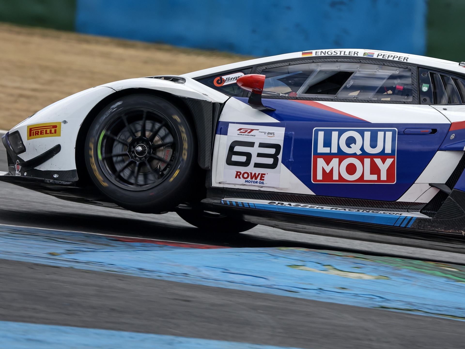 The Huracán Gt3 Evo2'S Magny-Cours Victory Adds A Defining Chapter To Lamborghini'S V10 Racing Legacy 3 Close-up dynamic shot of the #63 lamborghini huracán gt3 evo2 racing at magny-cours with its front wheel slightly off the ground