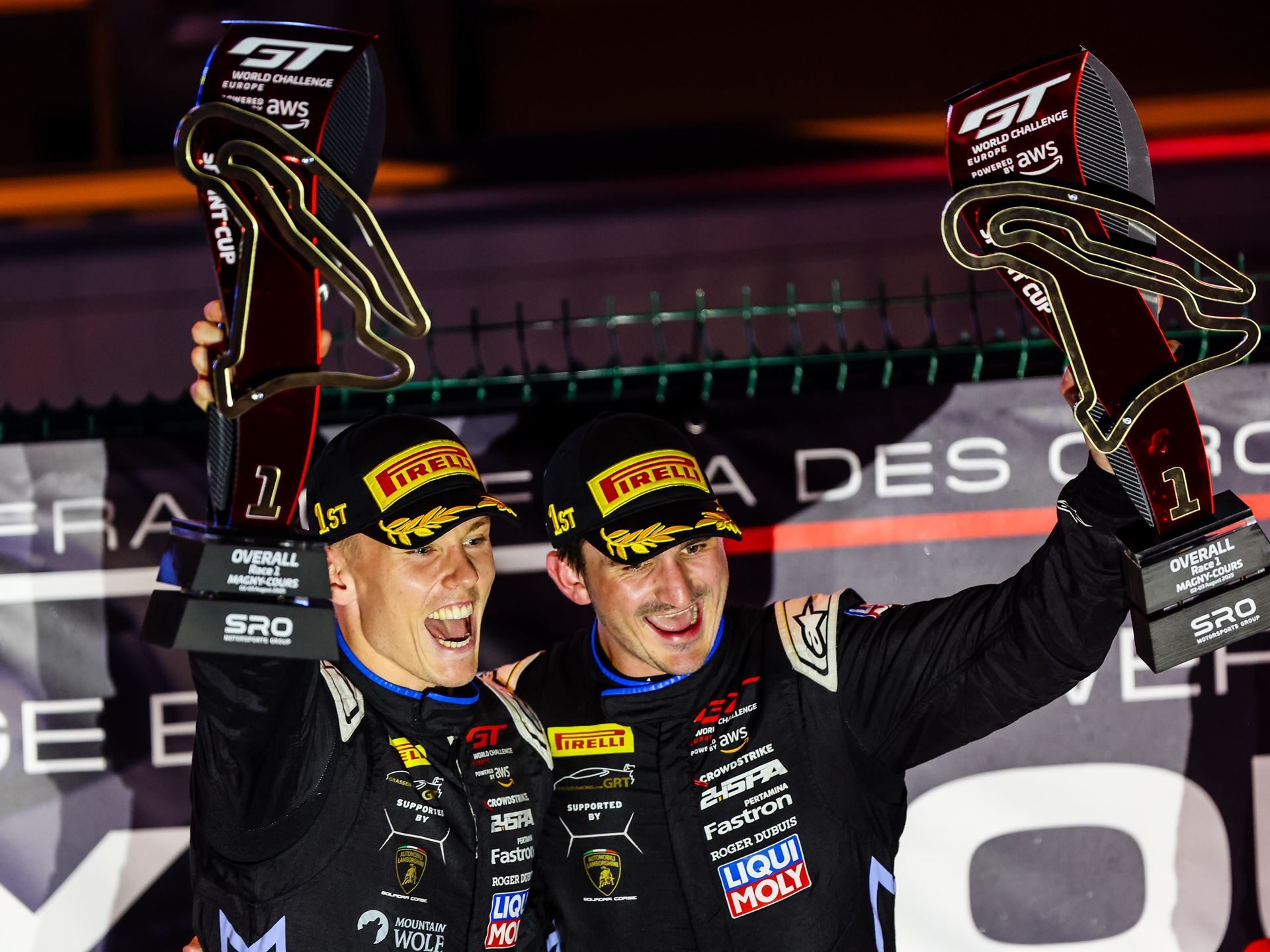 The Huracán Gt3 Evo2'S Magny-Cours Victory Adds A Defining Chapter To Lamborghini'S V10 Racing Legacy 5 Luca engstler and jordan pepper celebrating on the podium with trophies after their gt world challenge europe sprint cup victory