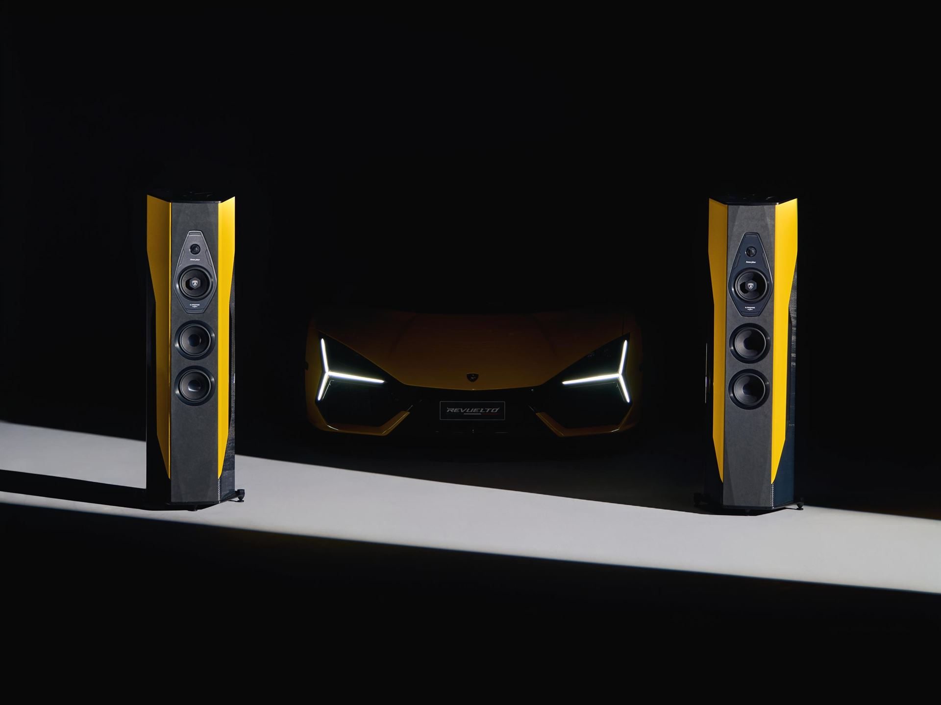 Lamborghini'S $130,000 Sonus Faber Speakers: What 50 Pairs And Five Paint Codes Reveal About The Brand'S Exclusivity Strategy 11 Low-light studio shot of the lamborghini revuelto front with y-shaped drls illuminated, flanked by two matching il cremonese ex3me speakers