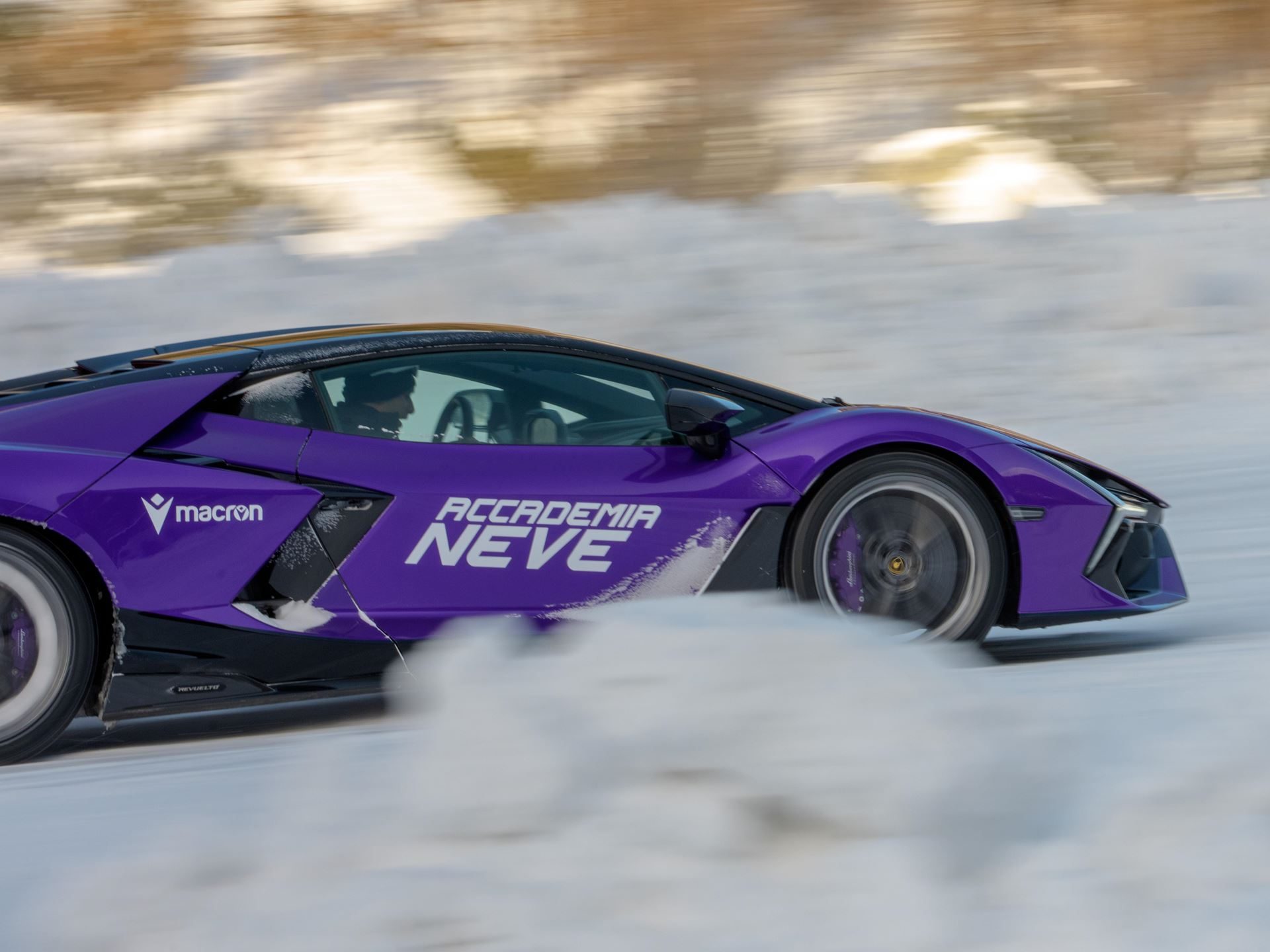 Accademia Neve 2026 Puts The Temerario On Ice, And Lamborghini'S Experiential Edge Over Rivals On Full Display 3 Purple lamborghini revuelto drifting sideways on snow-covered track at accademia neve 2026