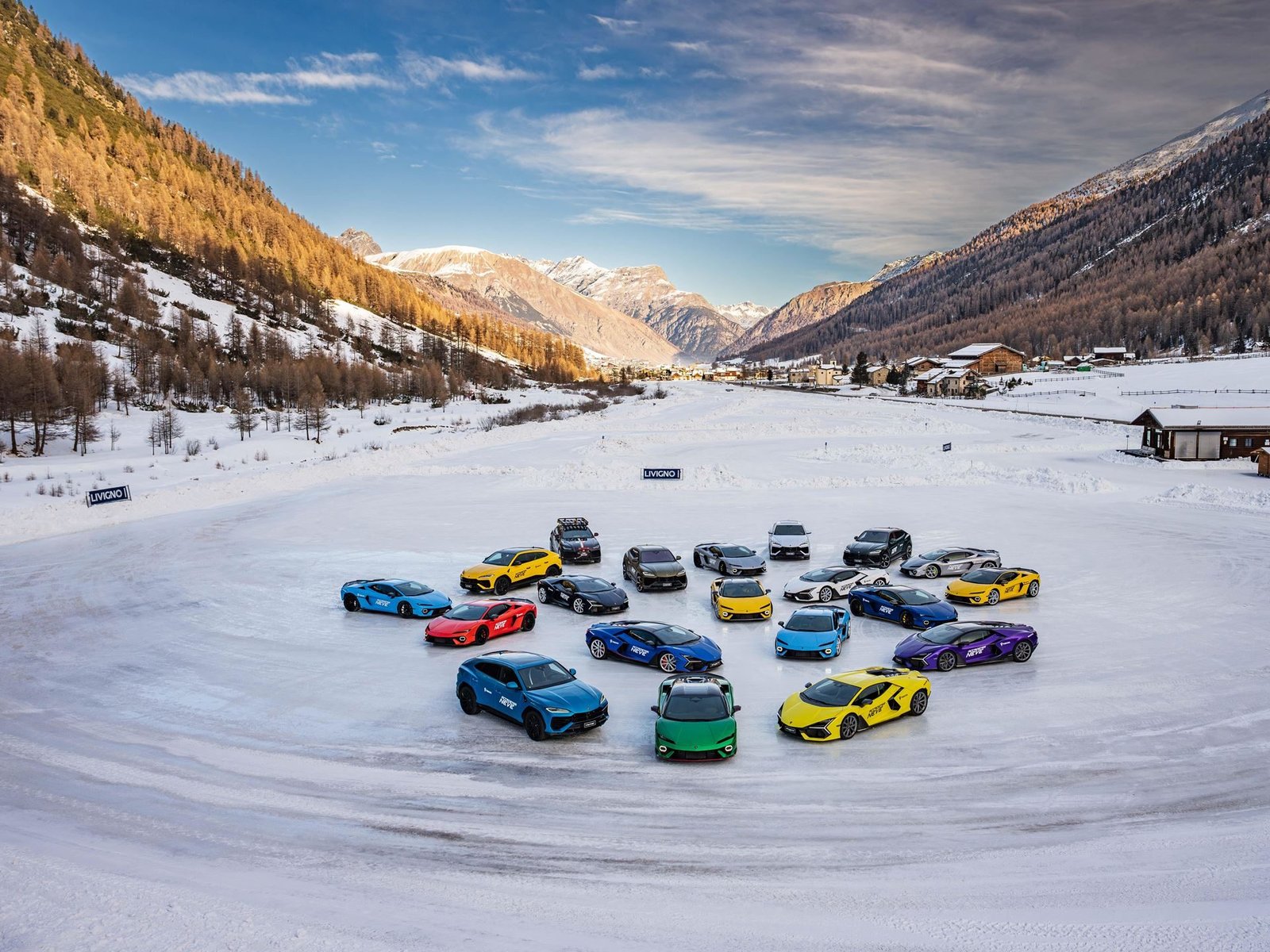 Lamborghini fleet arranged in a circular formation on snow-covered field at Accademia Neve 2026 in Livigno, Italy