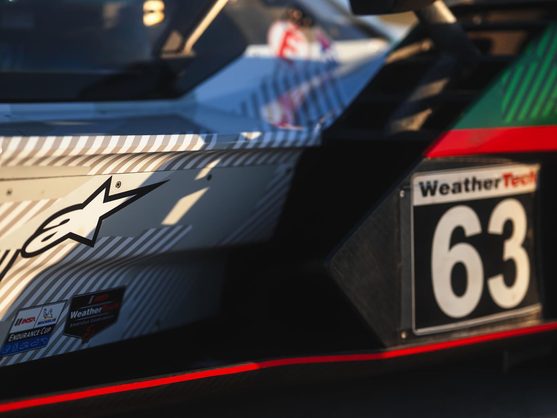 Alpinestars Will Suit Up Lamborghini'S Entire Racing Operation, From Super Trofeo To Lmdh 7 Close-up of the lamborghini sc63 rear quarter showing alpinestars logo and number 63 decal