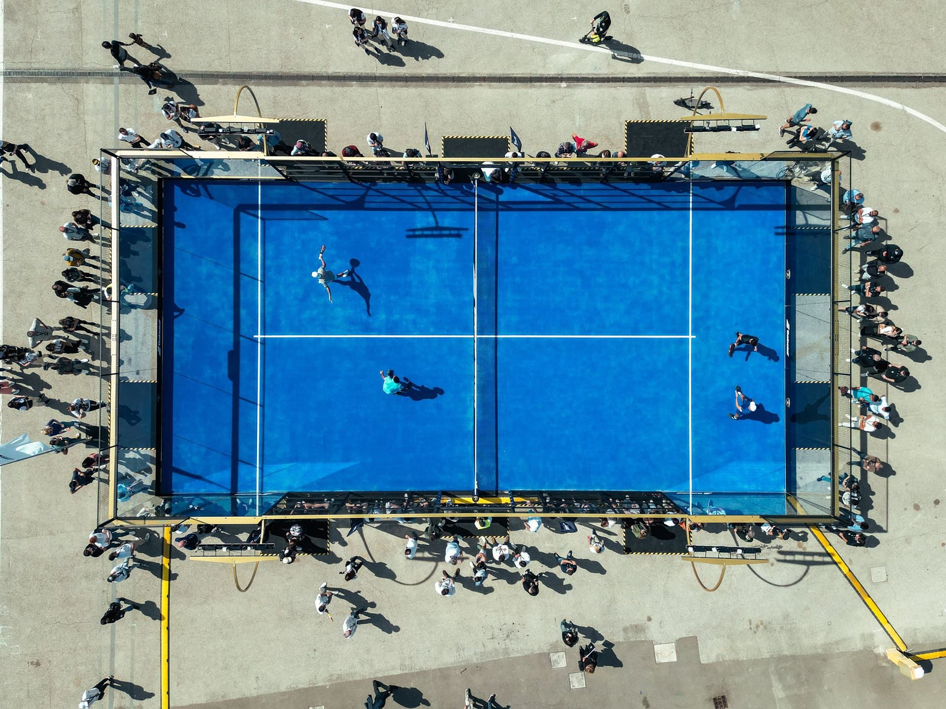 Lamborghini Arena Turns Imola Into A Brand Theme Park, While The Revuelto Sv Lurks Nearby 15 Aerial view of a blue padel tennis court with players and spectators at the lamborghini arena event