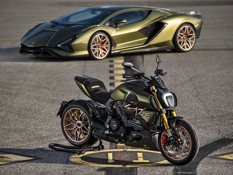 A matte green Lamborghini Sián FKP 37 parked alongside a matching green Ducati Diavel 1260 Lamborghini motorcycle with bronze wheels