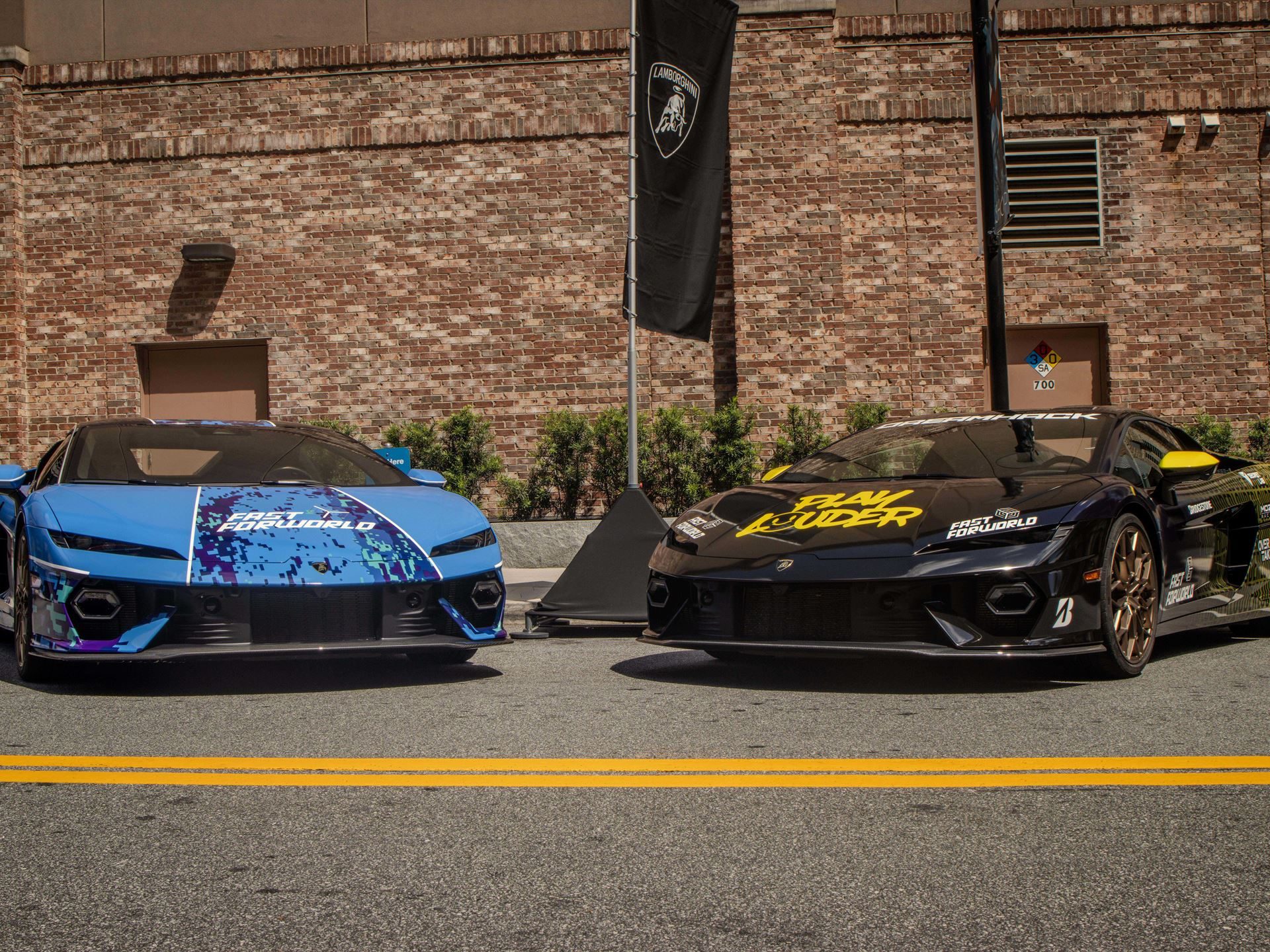 Two lamborghinis with custom gaming liveries parked side-by-side outdoors at dreamhack atlanta