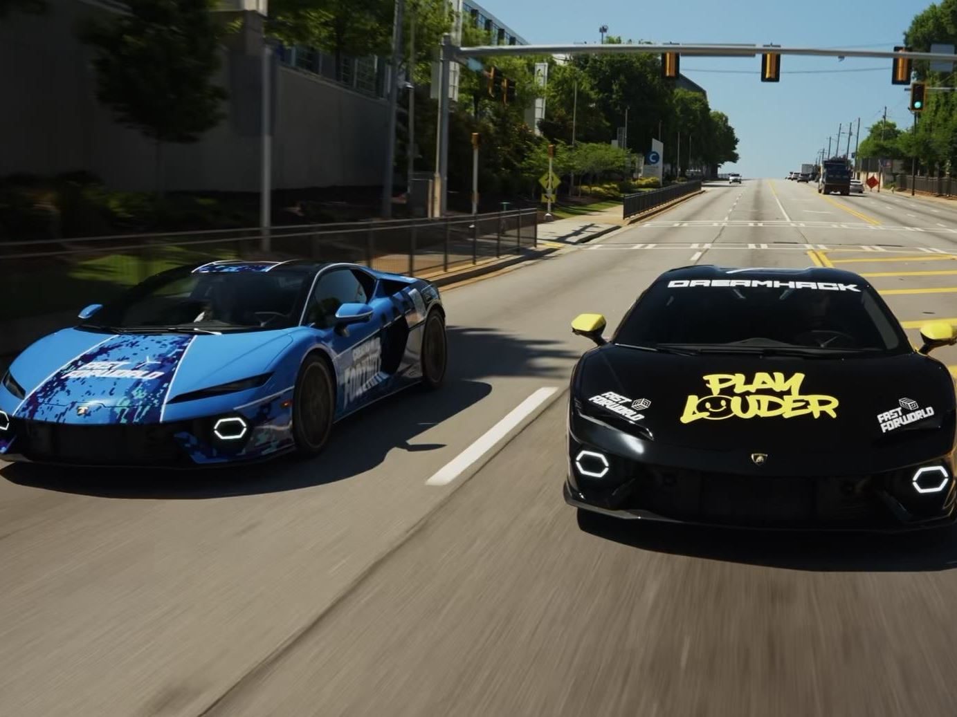 Two custom-wrapped lamborghini temerarios driving on an urban street during dreamhack atlanta 2026 activation