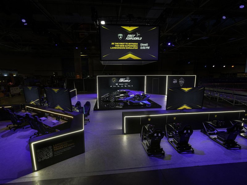 Overview of Lamborghini's 300 square meter booth at DreamHack Dallas 2025, featuring the Revuelto, racing simulators, and large display screens