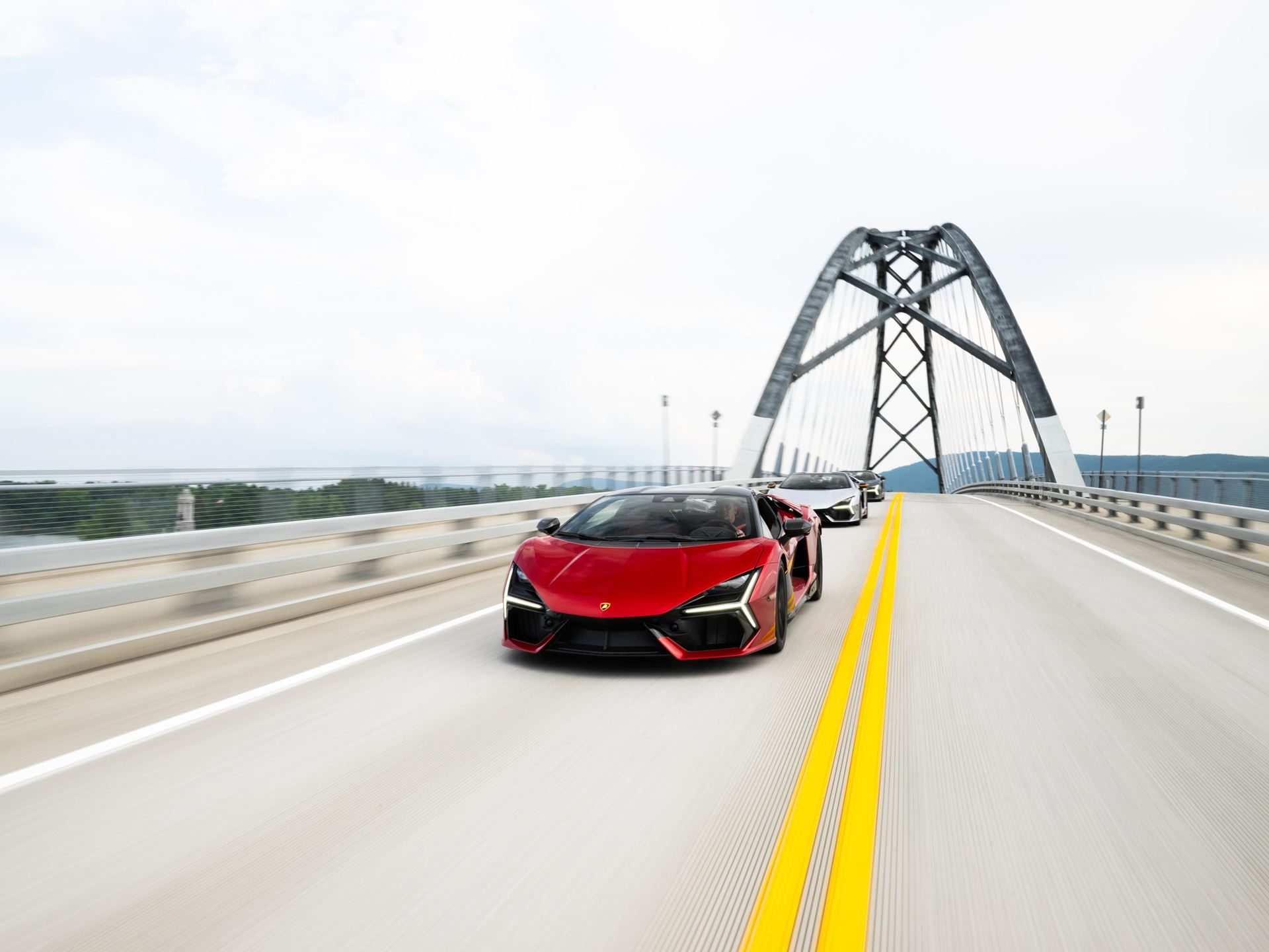 449 Miles Of New England Back Roads With 30 Lamborghinis: Inside The Esperienza Giro Usa 9 A red lamborghini sián fkp 37 speeds across a modern bridge followed by other lamborghinis