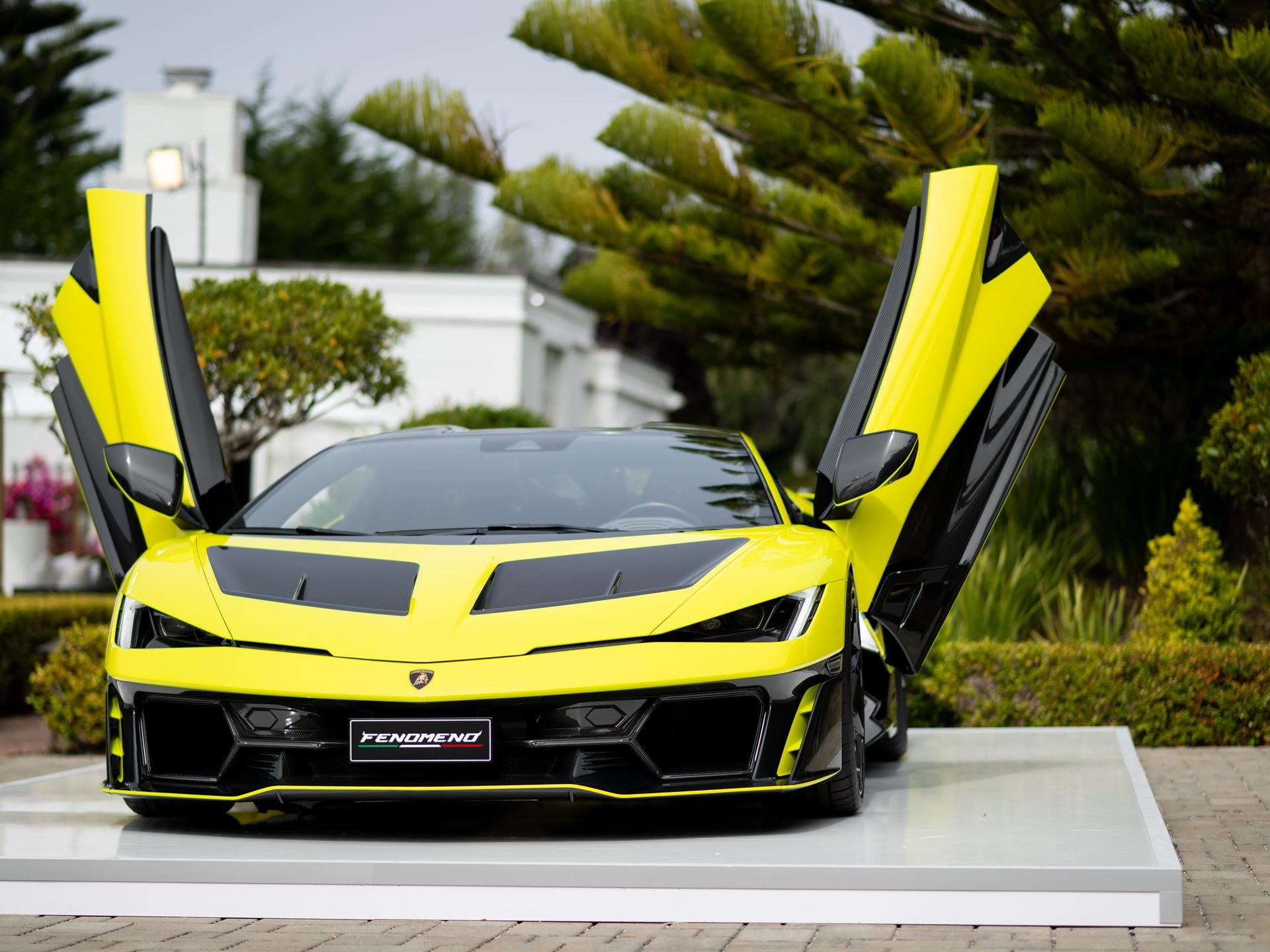Lamborghini'S 29-Unit Fenomeno Signals A New Kind Of Few-Off For Its Most Extreme Clientele 3 Lamborghini fenomeno displayed with scissor doors open, showing its yellow and black design at monterey