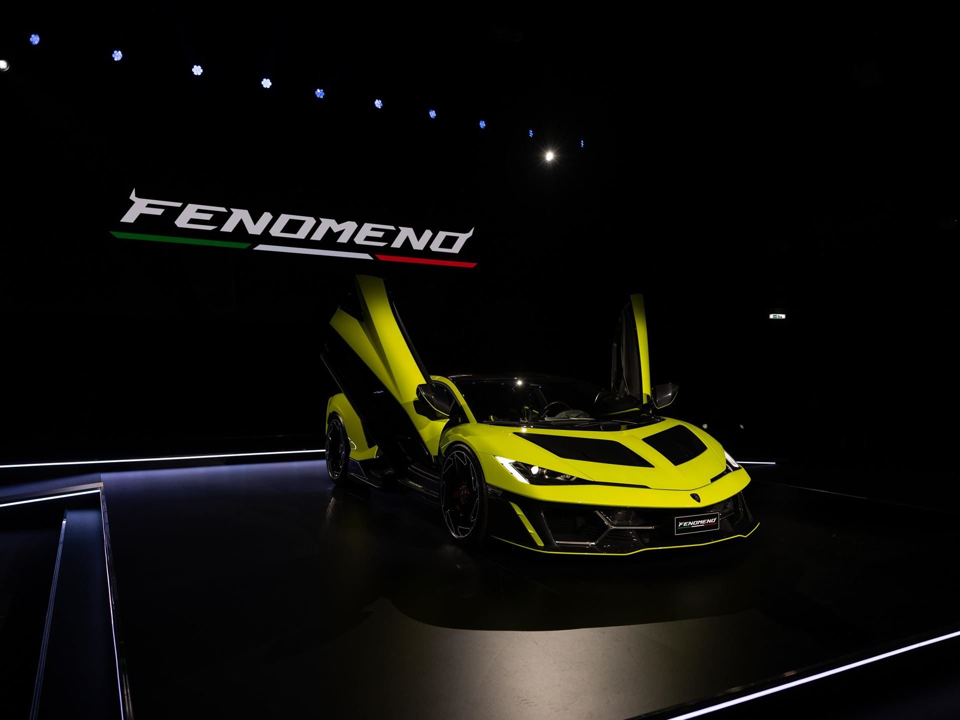 Lamborghini Day Uk Puts The Sold-Out Fenomeno And Drivable Temerario In Front Of 300 Owners At Millbrook 5 Yellow lamborghini fenomeno displayed with scissor doors open and large rear wing deployed under dramatic lighting