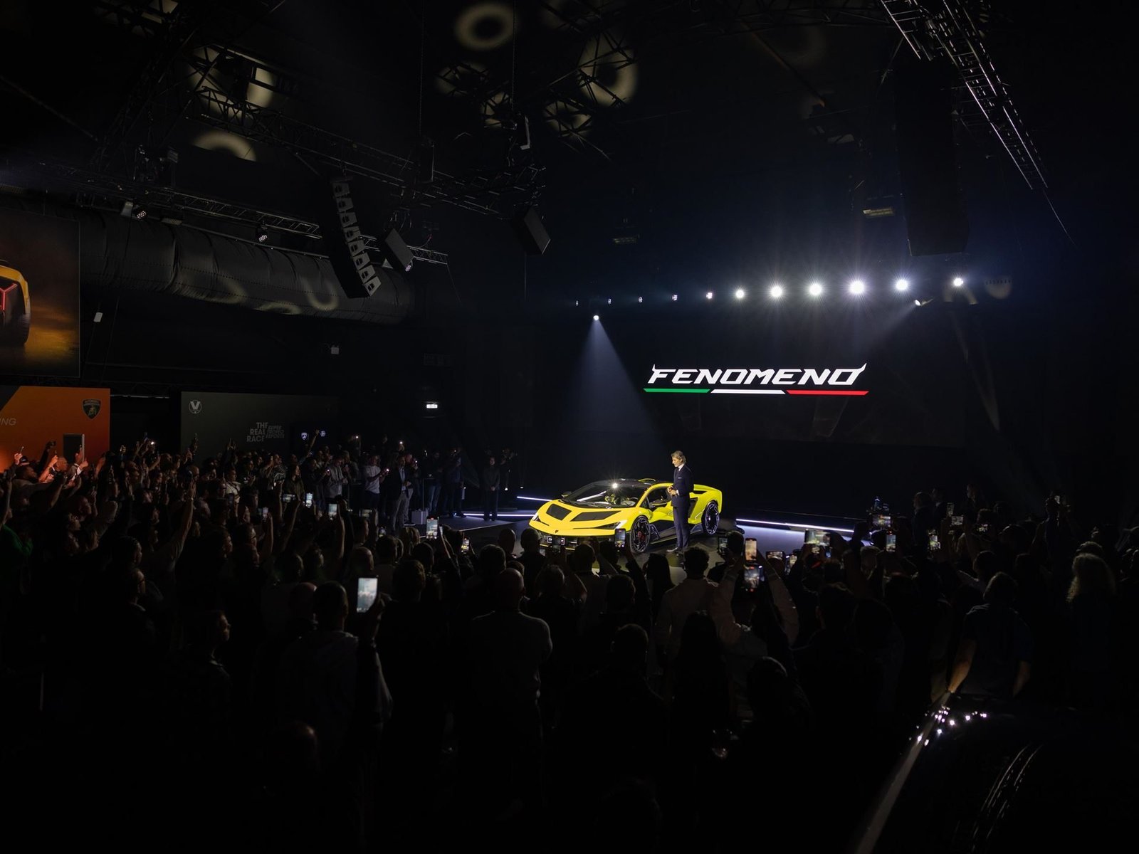 The yellow Lamborghini Fenomeno being unveiled on stage at Lamborghini Day UK 2025 at Millbrook Proving Ground