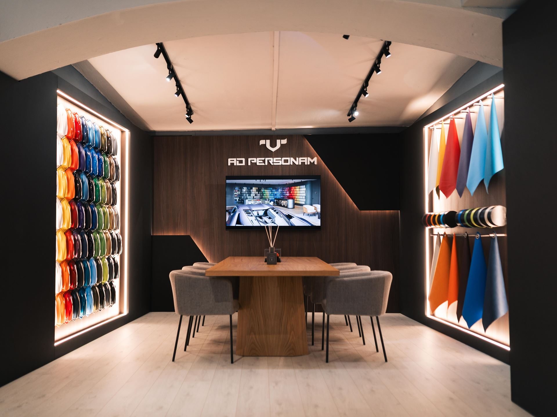 Lamborghini'S Porto Cervo Lounge Returns For A Seventh Summer, Now Showcasing An All-Hybrid Lineup 5 The ad personam customization studio inside the lamborghini lounge porto cervo with paint samples and material swatches on display