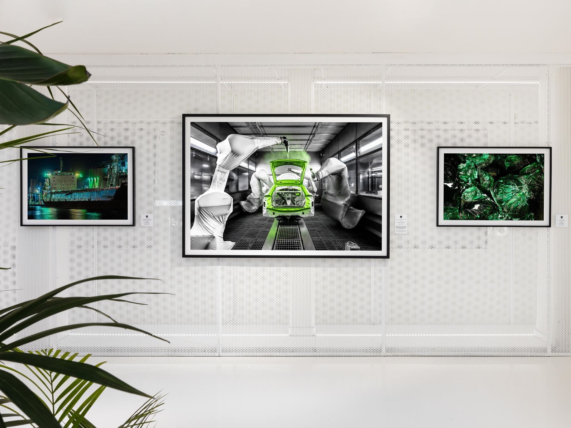 Lamborghini'S Museum Turns Its Own Factory Into Fine Art With Lucrezia Roda'S 'The Industrial Perspective' 5 A large framed photograph of a green lamborghini urus being assembled by robotic arms, displayed in the automobili lamborghini museum