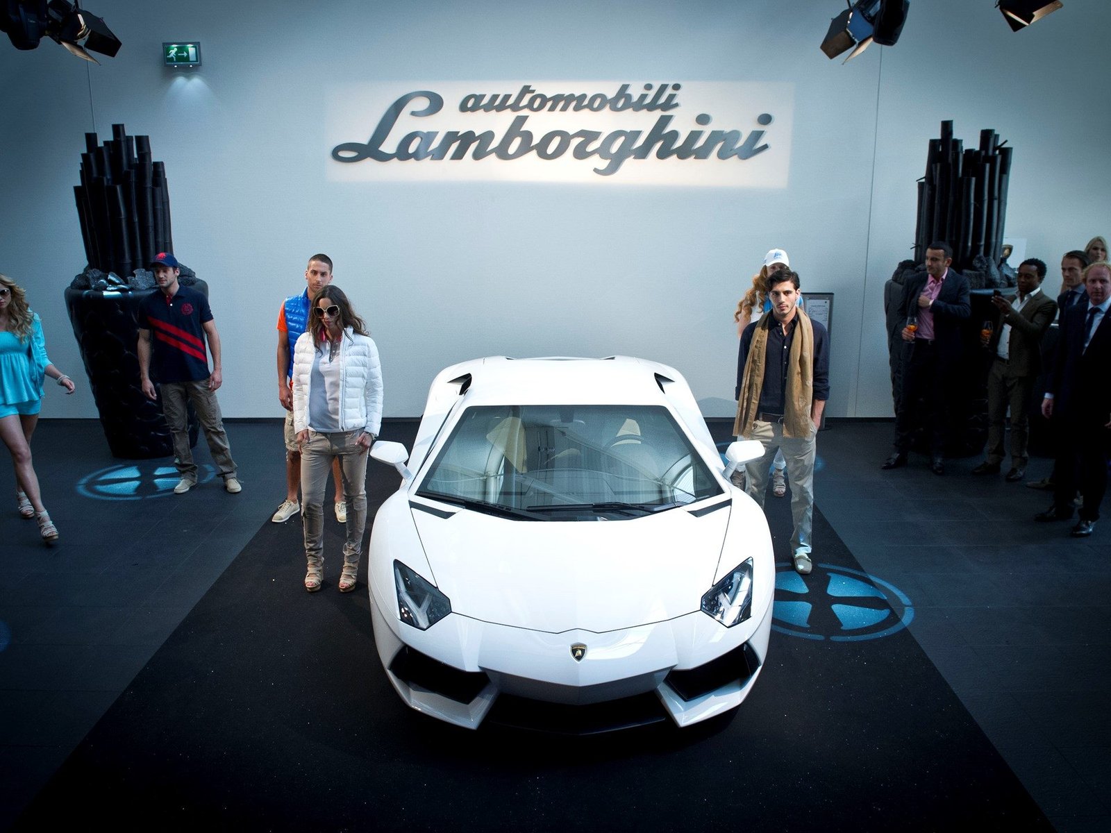 White Lamborghini Aventador LP 700-4 surrounded by event guests at the Dutch dealership opening
