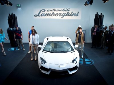 How Pon Holdings Became Lamborghini'S Exclusive Dutch Partner, Celebrated With Aventador Flair 2 White lamborghini aventador lp 700-4 surrounded by event guests at the dutch dealership opening