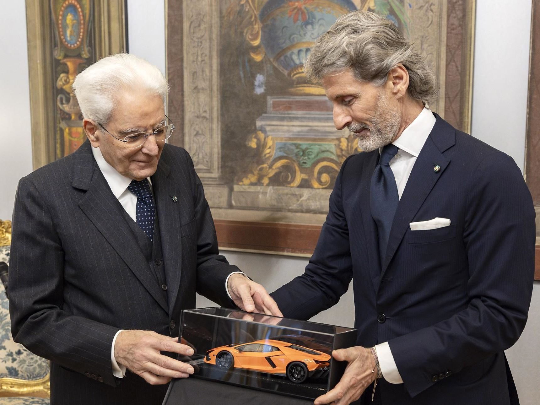 Why Lamborghini'S Meeting With Italy'S President Matters More Than The Photo Op Suggests 3 Stephan winkelmann presents an orange lamborghini aventador scale model in a display case to president mattarella