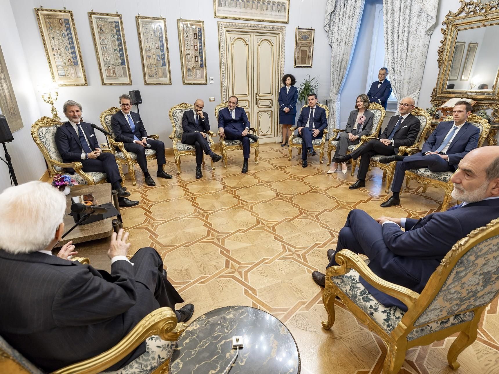 Why Lamborghini'S Meeting With Italy'S President Matters More Than The Photo Op Suggests 5 Overhead view of lamborghini executives and president mattarella seated in discussion at the quirinale palace