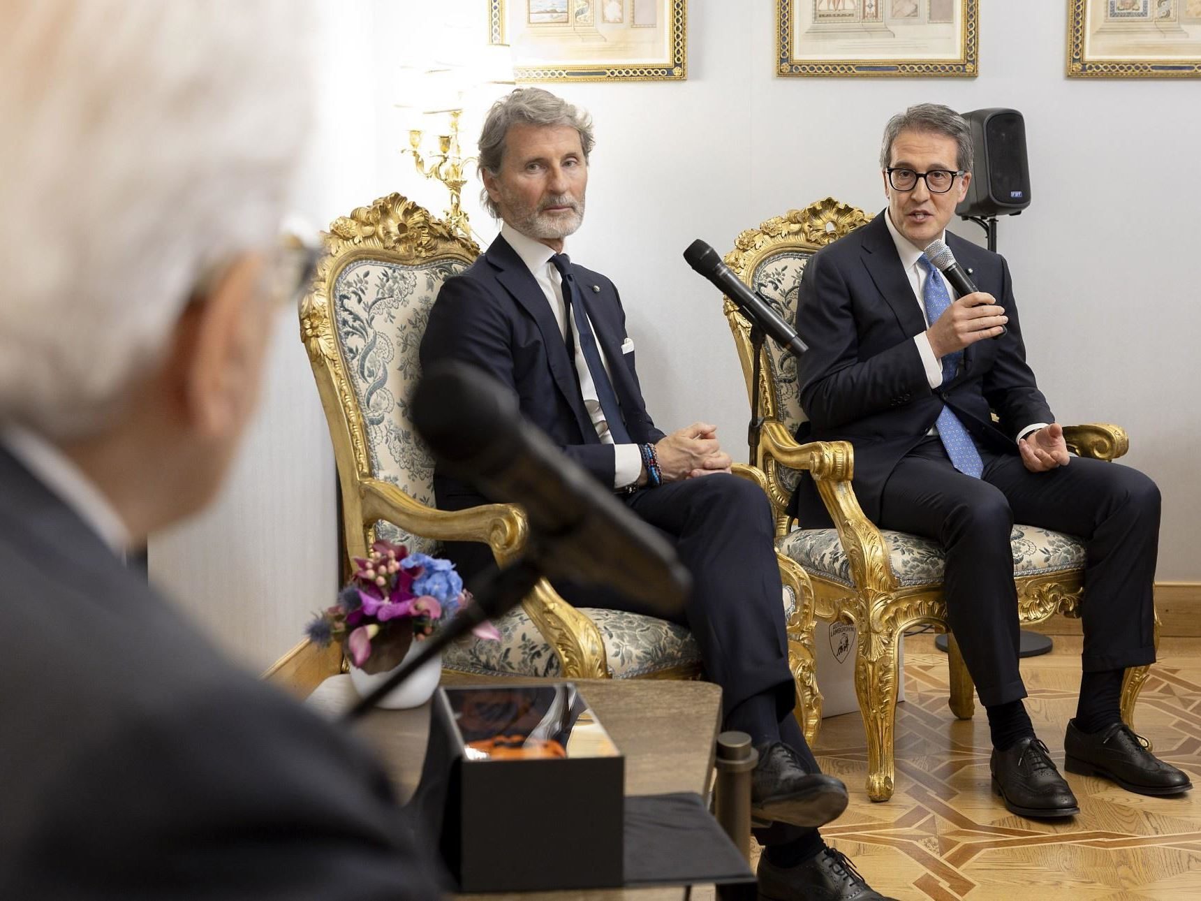 Why Lamborghini'S Meeting With Italy'S President Matters More Than The Photo Op Suggests 7 Stephan winkelmann and a lamborghini executive seated in ornate chairs during the formal meeting with president mattarella