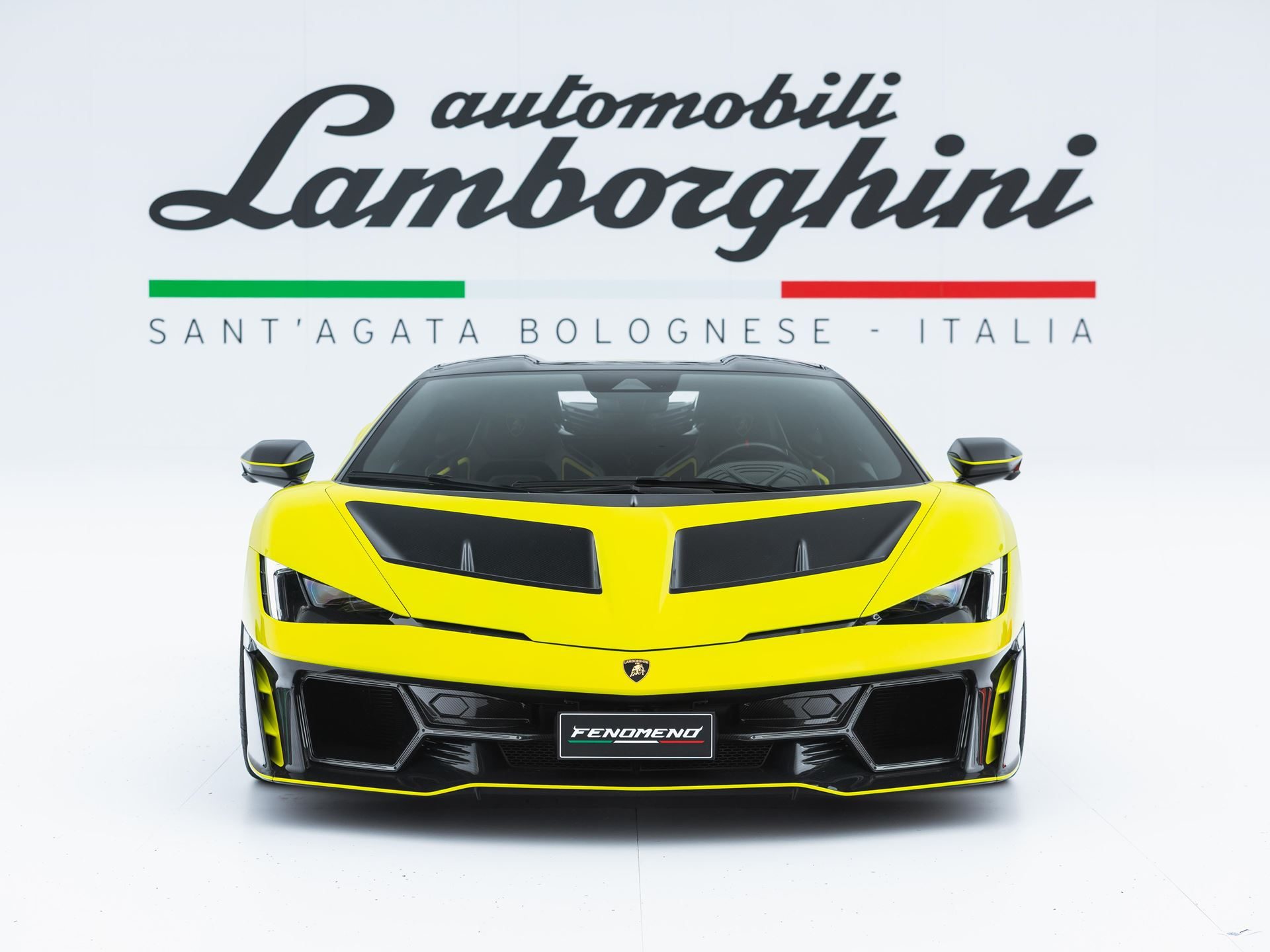 Lamborghini'S 24.6% Profit Margin Bankrolls The Temerario Era, Even As Tariffs And Currency Bite 5 Yellow lamborghini fenomeno presented head-on in a studio with the automobili lamborghini logo behind it