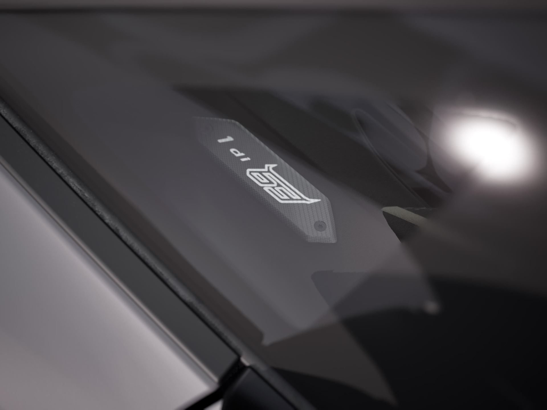 Revuelto Na63: 63 Units, Two Countries, And Lamborghini'S Sharpest Play For North American Collectors 5 Close-up of the revuelto na63 interior plaque reading '1 di 63' with carbon fiber texture and 63 logo