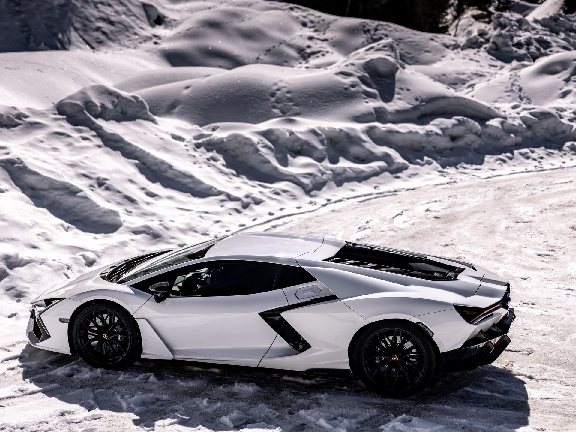 Lamborghini Took Its Hybrid Lineup To The French Alps, And The Convoy Included A Surprise Guest 25 Lamborghini revuelto urus se courchevel alps draft 65e37ce1 exterior 012