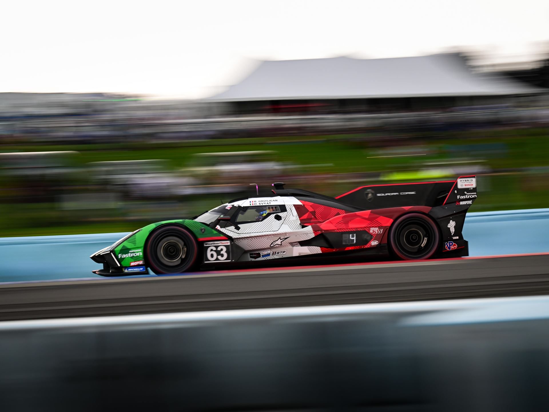 Lamborghini Sc63 Returns To Its Breakthrough Circuit At Indianapolis, Carrying Watkins Glen Momentum 3 Lamborghini sc63 lmdh prototype at speed with motion blur highlighting its aerodynamic profile